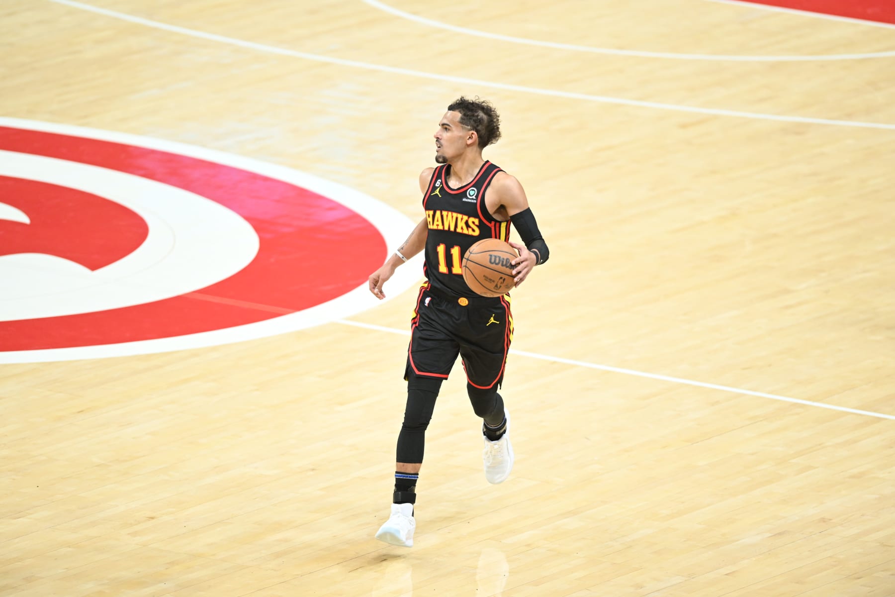 ATLANTA, GA - APRIL 23: Trae Young #11 of the Atlanta Hawks dribbles the ball during Round One Game Four of the 2023 NBA Playoffs on April 23, 2023 at State Farm Arena in Atlanta, Georgia.  NOTE TO USER: User expressly acknowledges and agrees that, by downloading and/or using this Photograph, user is consenting to the terms and conditions of the Getty Images License Agreement. Mandatory Copyright Notice: Copyright 2023 NBAE (Photo by Adam Hagy/NBAE via Getty Images)