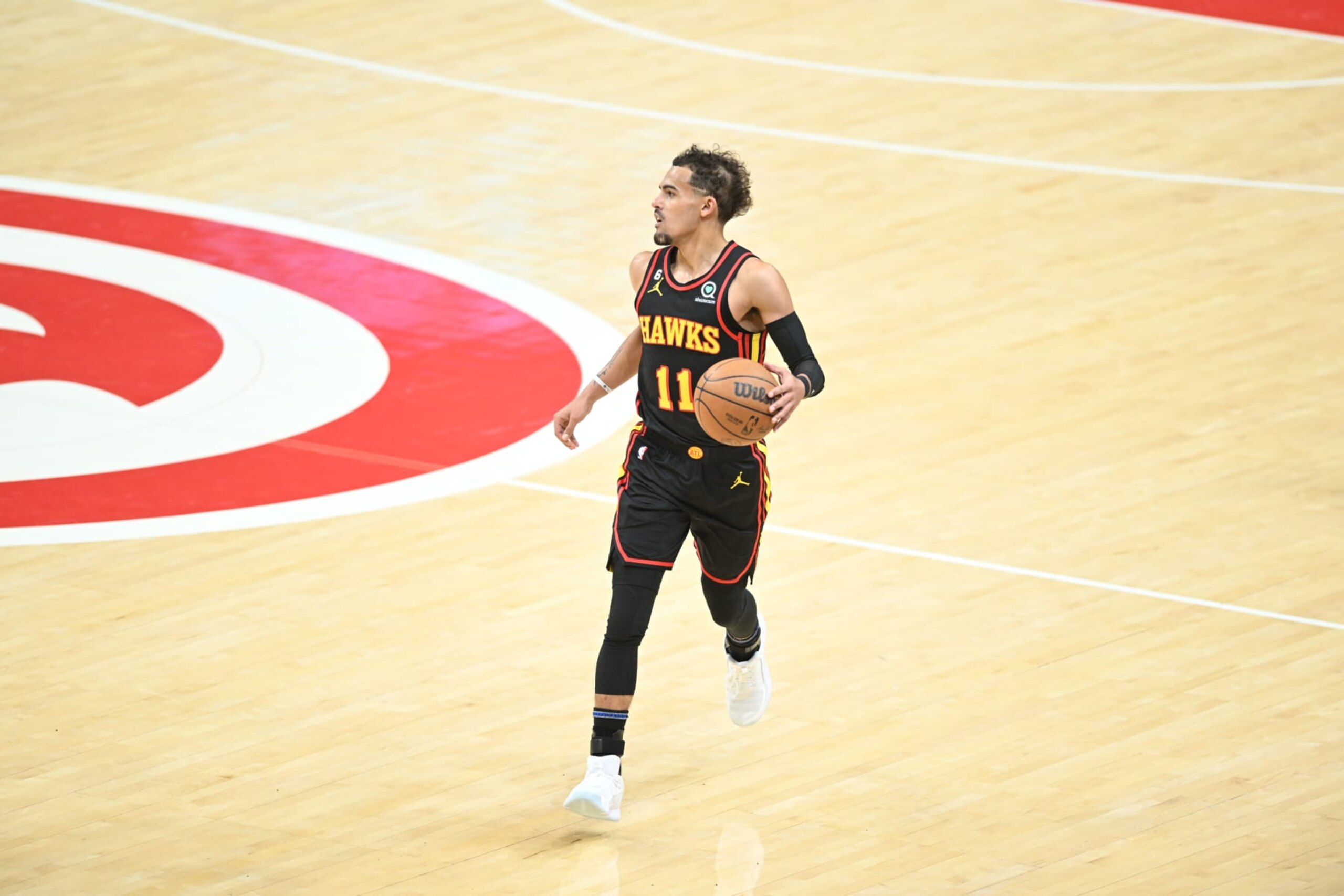 ATLANTA, GA - APRIL 23: Trae Young #11 of the Atlanta Hawks dribbles the ball during Round One Game Four of the 2023 NBA Playoffs on April 23, 2023 at State Farm Arena in Atlanta, Georgia. NOTE TO USER: User expressly acknowledges and agrees that, by downloading and/or using this Photograph, user is consenting to the terms and conditions of the Getty Images License Agreement. Mandatory Copyright Notice: Copyright 2023 NBAE (Photo by Adam Hagy/NBAE via Getty Images) ATLANTA, GA - APRIL 23: Trae Young #11 of the Atlanta Hawks dribbles the ball during Round One Game Four of the 2023 NBA Playoffs on April 23, 2023 at State Farm Arena in Atlanta, Georgia. NOTE TO USER: User expressly acknowledges and agrees that, by downloading and/or using this Photograph, user is consenting to the terms and conditions of the Getty Images License Agreement. Mandatory Copyright Notice: Copyright 2023 NBAE (Photo by Adam Hagy/NBAE via Getty Images)
