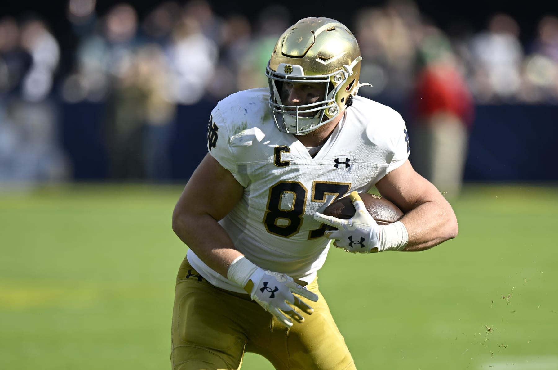 BALTIMORE, MARYLAND - NOVEMBER 12: Michael Mayer #87 of the Notre Dame Fighting Irish runs with the ball after making a catch against the Navy Midshipmen at M&T Bank Stadium on November 12, 2022 in Baltimore, Maryland. (Photo by G Fiume/Getty Images)
