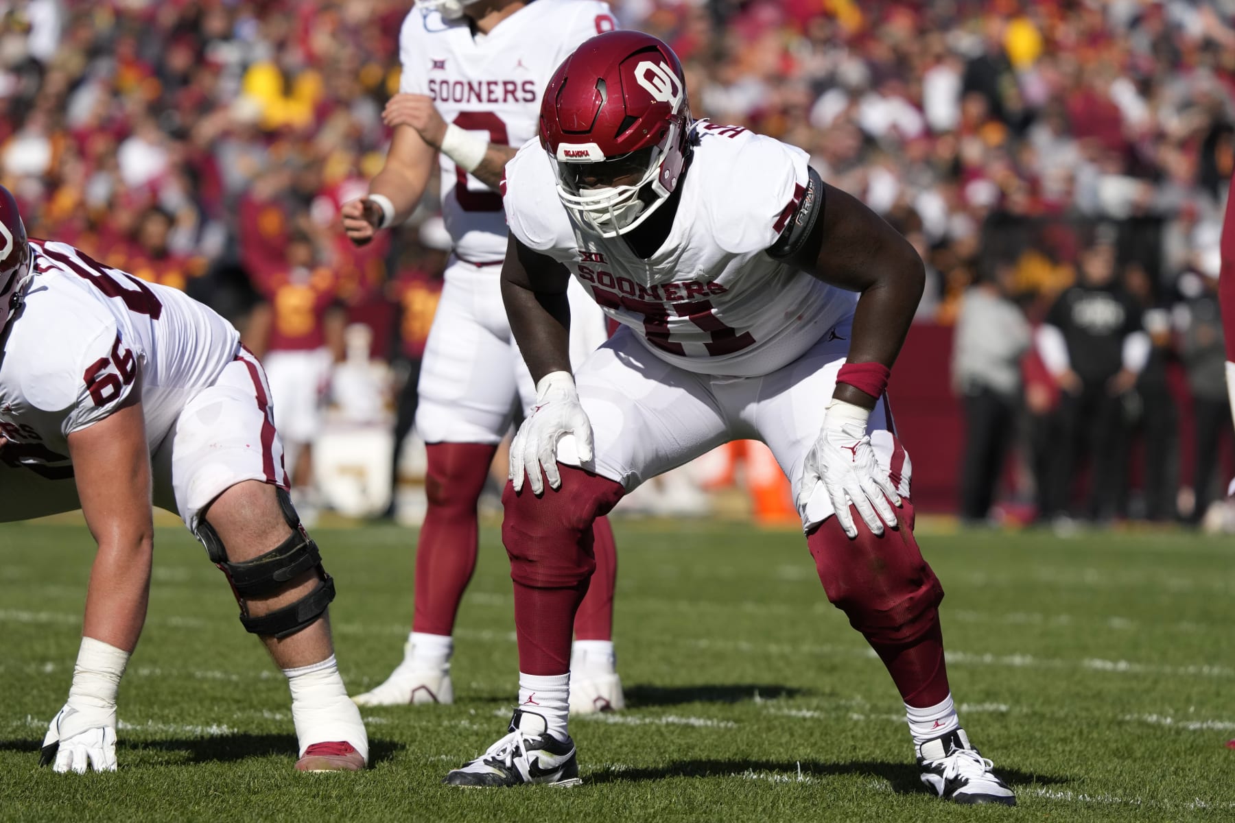 Oklahoma offensive lineman Anton Harrison (71) gets set for a play during the first half of an NCAA college football game against Iowa State, Saturday, Oct. 29, 2022, in Ames, Iowa. (AP Photo/Charlie Neibergall)