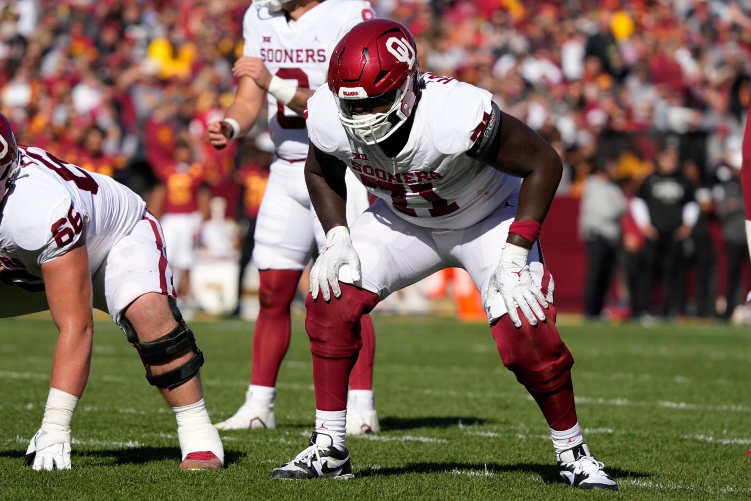 Oklahoma offensive lineman Anton Harrison (71) gets set for a play during the first half of an NCAA college football game against Iowa State, Saturday, Oct. 29, 2022, in Ames, Iowa. (AP Photo/Charlie Neibergall)