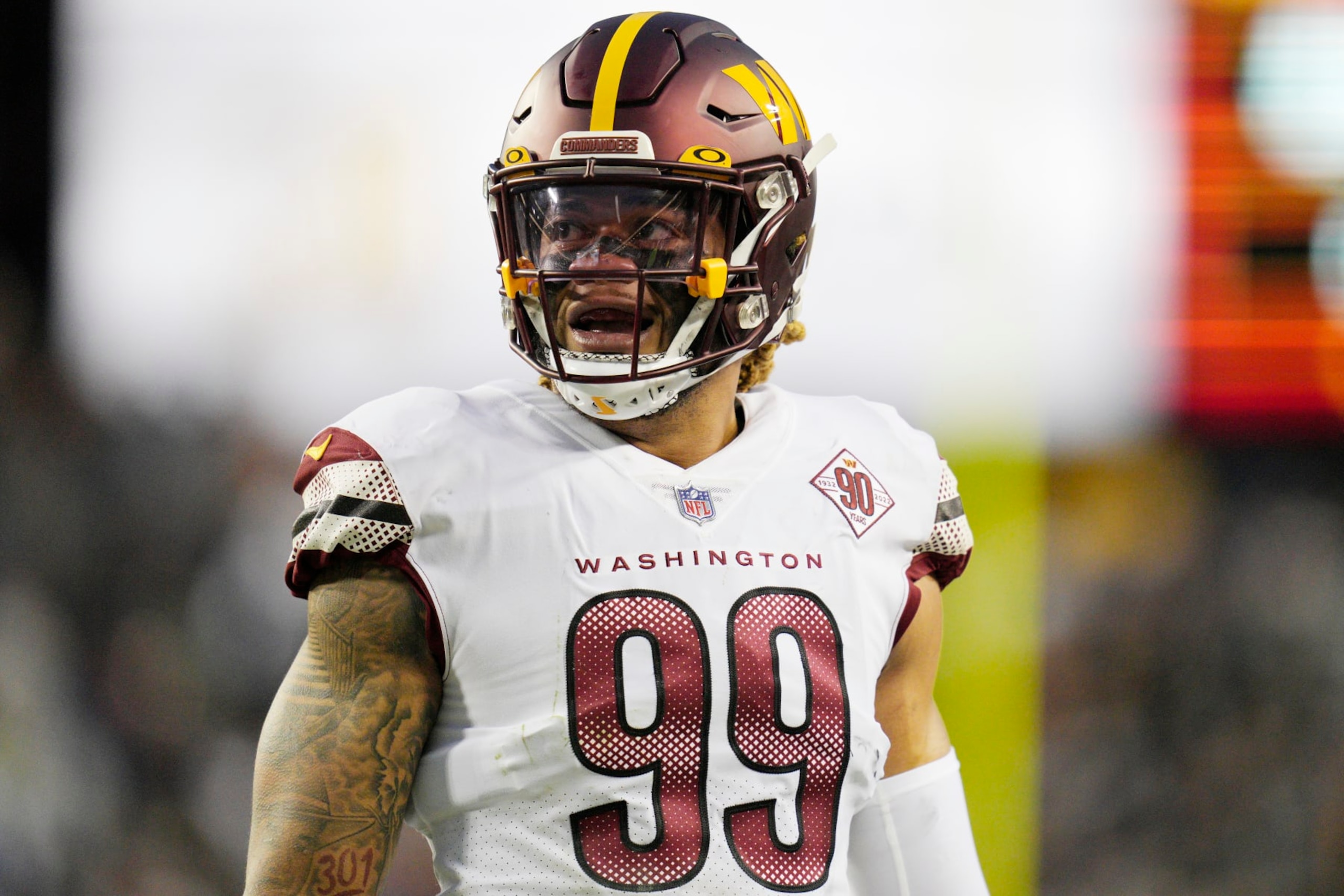 LANDOVER, MARYLAND - JANUARY 08: Chase Young #99 of the Washington Commanders looks on during the first half of the game against the Dallas Cowboys at FedExField on January 08, 2023 in Landover, Maryland. (Photo by Jess Rapfogel/Getty Images)
