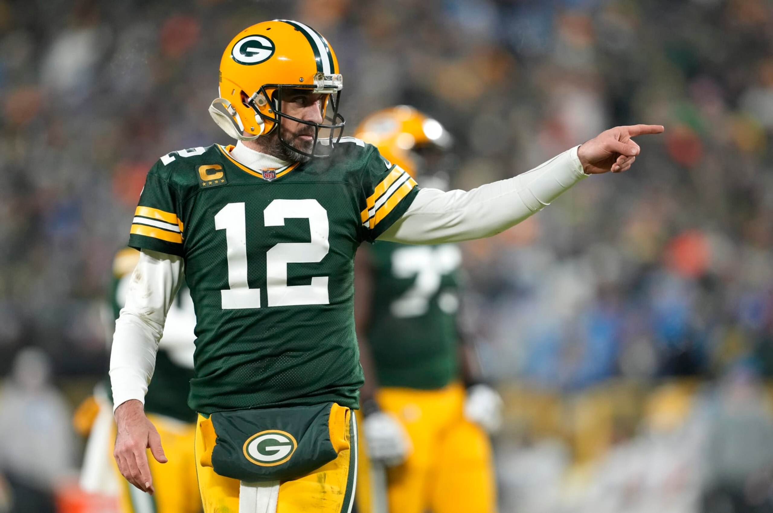 GREEN BAY, WISCONSIN - JANUARY 08: Aaron Rodgers #12 of the Green Bay Packers reacts after throwing a touchdown pass during the third quarter against the Detroit Lions at Lambeau Field on January 08, 2023 in Green Bay, Wisconsin. (Photo by Patrick McDermott/Getty Images) GREEN BAY, WISCONSIN - JANUARY 08: Aaron Rodgers #12 of the Green Bay Packers reacts after throwing a touchdown pass during the third quarter against the Detroit Lions at Lambeau Field on January 08, 2023 in Green Bay, Wisconsin. (Photo by Patrick McDermott/Getty Images)