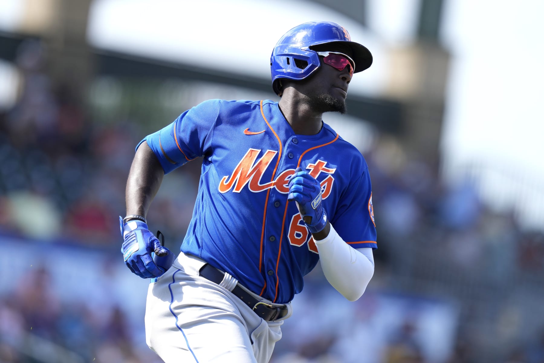 New York Mets' Ronny Mauricio runs to first with a single during the of a spring training baseball game against the Miami Marlins, Saturday, March 4, 2023, in Jupiter, Fla. (AP Photo/Lynne Sladky)
