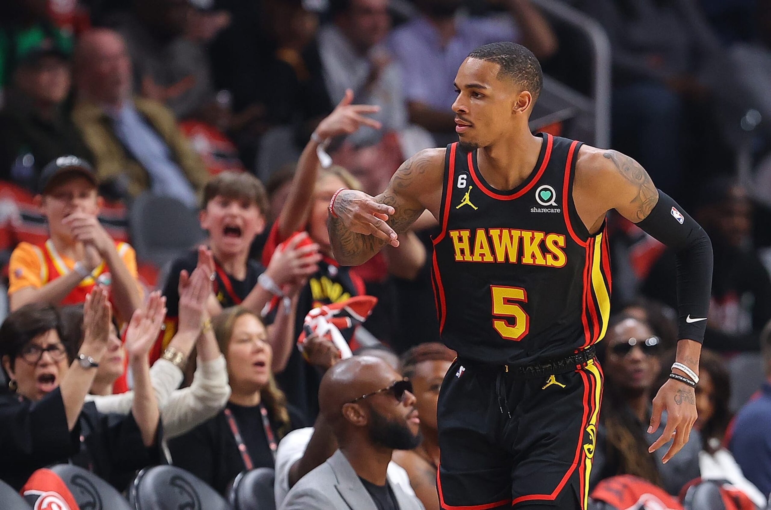 ATLANTA, GEORGIA - APRIL 23:  Dejounte Murray #5 of the Atlanta Hawks reacts after hitting a three-point basket against the Boston Celtics during the first quarter of Game Four of the Eastern Conference First Round Playoffs at State Farm Arena on April 23, 2023 in Atlanta, Georgia. NOTE TO USER: User expressly acknowledges and agrees that, by downloading and or using this photograph, User is consenting to the terms and conditions of the Getty Images License Agreement.  (Photo by Kevin C. Cox/Getty Images)