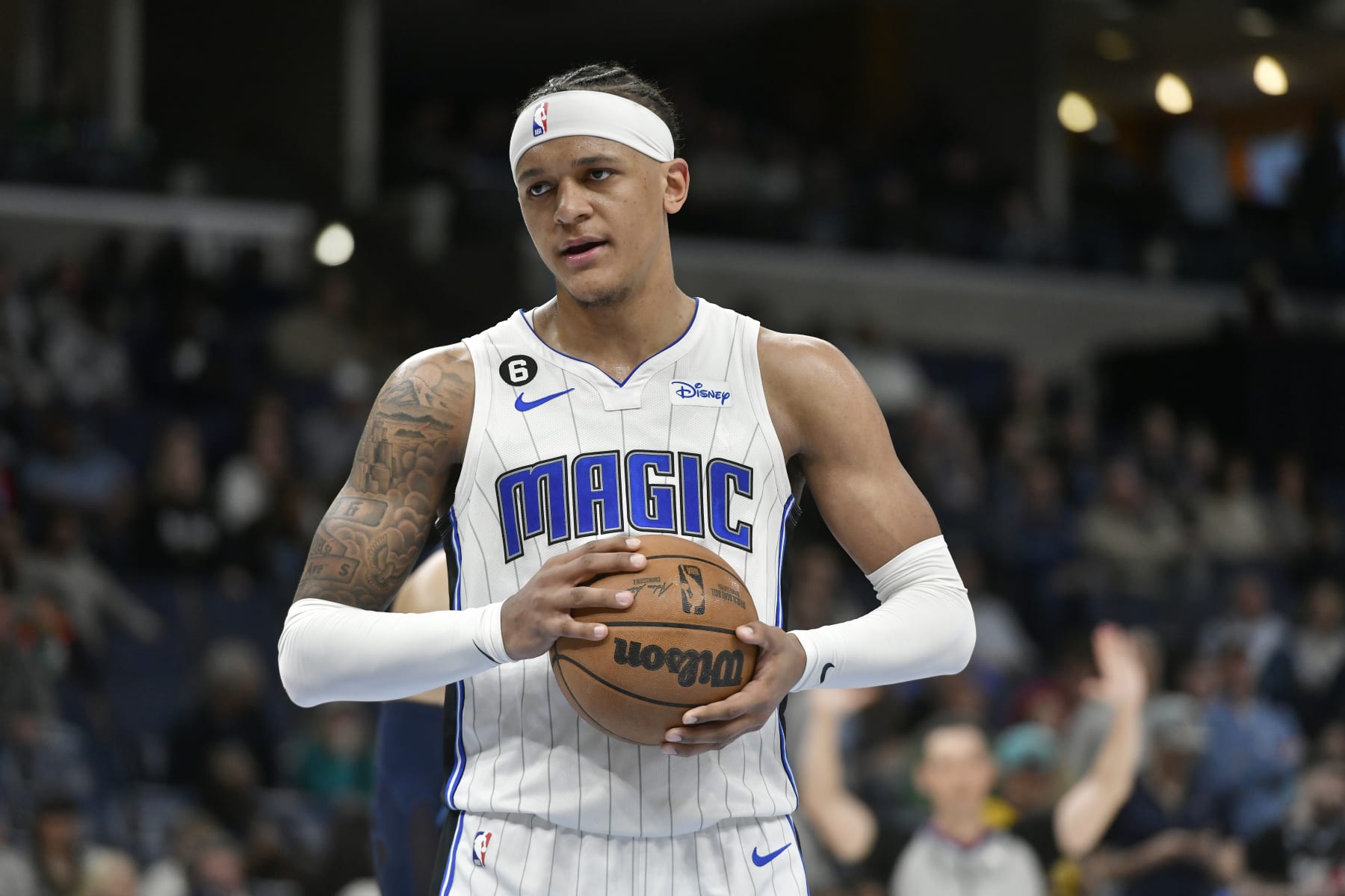 Orlando Magic forward Paolo Banchero plays in the second half of an NBA basketball game against the Memphis Grizzlies Tuesday, March 28, 2023, in Memphis, Tenn. (AP Photo/Brandon Dill)