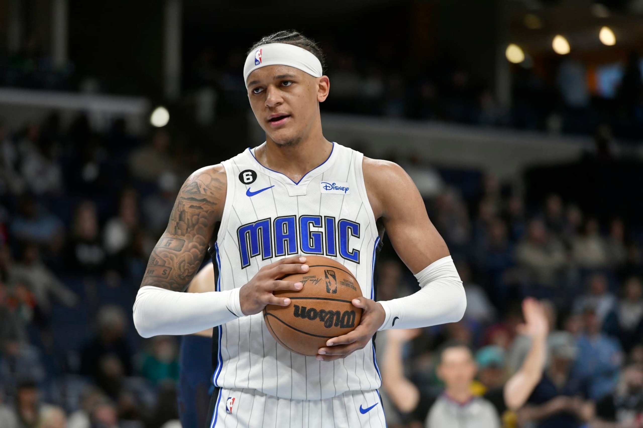 Orlando Magic forward Paolo Banchero plays in the second half of an NBA basketball game against the Memphis Grizzlies Tuesday, March 28, 2023, in Memphis, Tenn. (AP Photo/Brandon Dill)