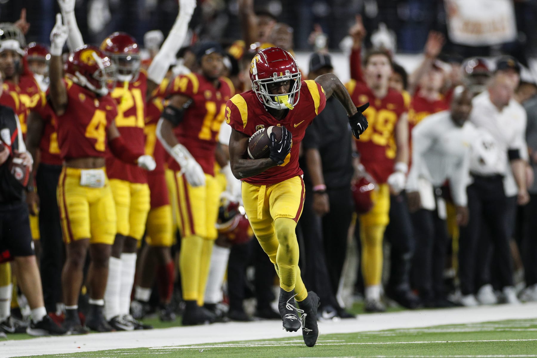 LAS VEGAS, NV - DECEMBER 02: USC Trojans wide receiver Jordan Addison (3) runs with the ball during the Pac-12 Championship football game between the Utah Utes and the USC Trojans on December 2, 2022 at Allegiant Stadium in Las Vegas. (Photo by Brandon Sloter/Icon Sportswire via Getty Images)