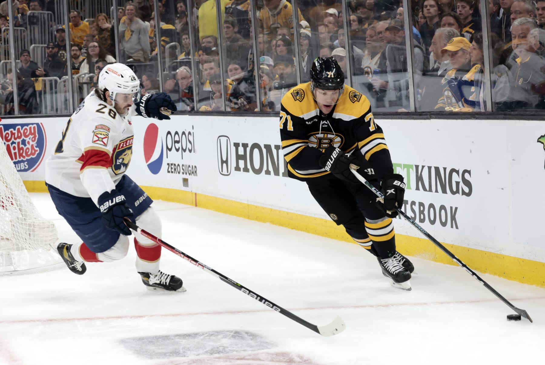 BOSTON, MA - APRIL 19: Florida Panthers defenseman Josh Mahura (28) moves in on Boston Bruins left wing Taylor Hall (71) during Game 2 of an Eastern Conference First Round playoff contest between the Boston Bruins and the Florida Panthers on April 19, 2023, at TD Garden in Boston, Massachusetts. (Photo by Fred Kfoury III/Icon Sportswire via Getty Images)