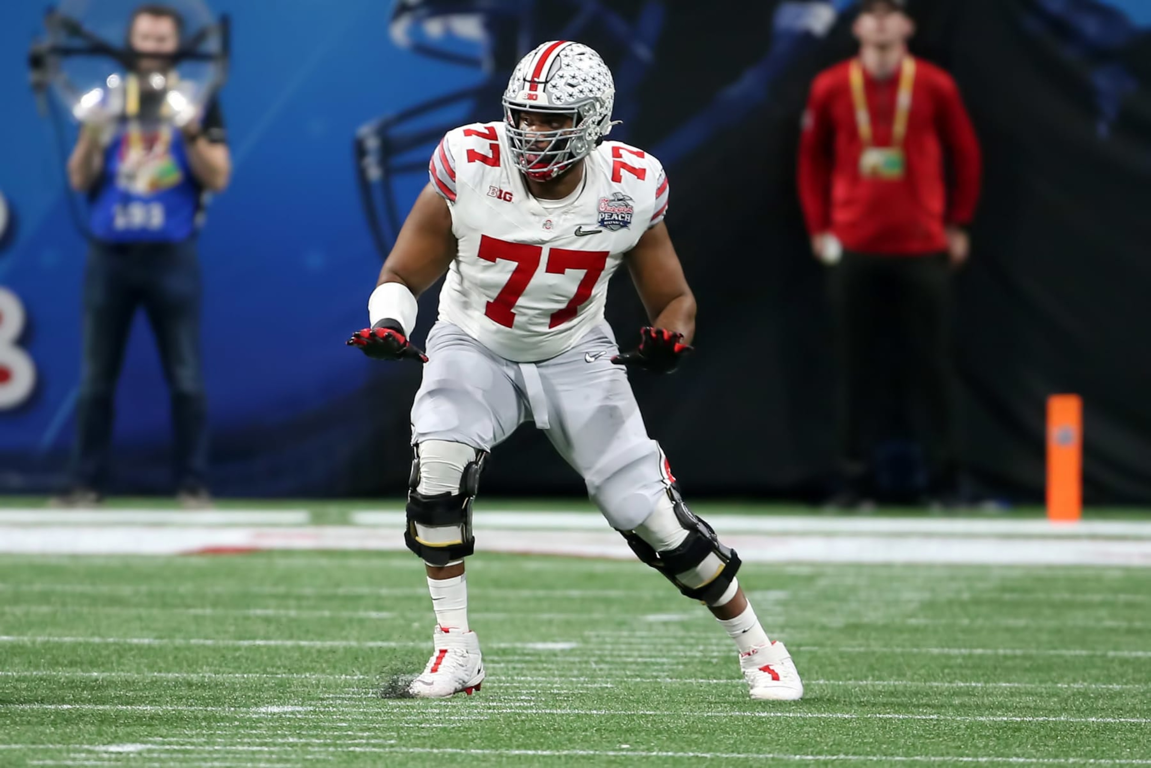 ATLANTA, GA - DECEMBER 31: Ohio State Buckeyes offensive lineman Paris Johnson Jr. (77) during the college football Playoff Semifinal game at the Chick-fil-a Peach Bowl between the Georgia Bulldogs and the Ohio State Buckeyes on December 31, 2022 at Mercedes-Benz Stadium in Atlanta, Georgia. (Photo by Michael Wade/Icon Sportswire via Getty Images) ATLANTA, GA - DECEMBER 31: Ohio State Buckeyes offensive lineman Paris Johnson Jr. (77) during the college football Playoff Semifinal game at the Chick-fil-a Peach Bowl between the Georgia Bulldogs and the Ohio State Buckeyes on December 31, 2022 at Mercedes-Benz Stadium in Atlanta, Georgia. (Photo by Michael Wade/Icon Sportswire via Getty Images)