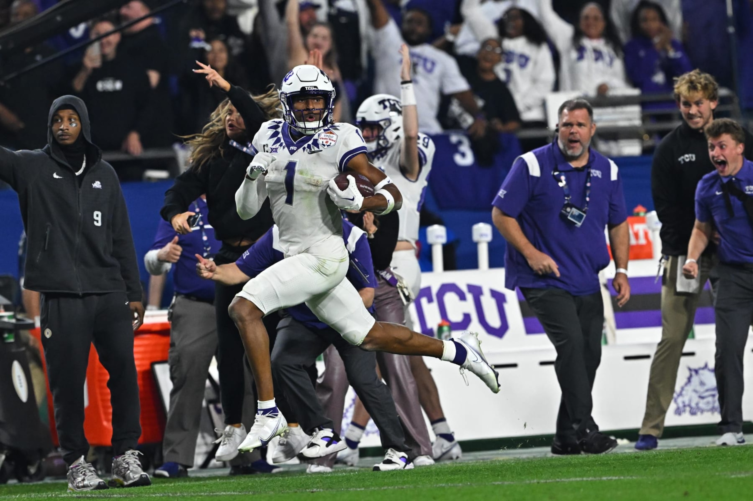 College Football: Fiesta Bowl: TCU Quentin Johnston (1) in action, runs with the football vs Michigan at State Farm Stadium. Glendale, AZ 12/31/2022 CREDIT: John W. McDonough (Photo by John W. McDonough /Sports Illustrated via Getty Images) (Set Number: X164269 TK1) College Football: Fiesta Bowl: TCU Quentin Johnston (1) in action, runs with the football vs Michigan at State Farm Stadium. Glendale, AZ 12/31/2022 CREDIT: John W. McDonough (Photo by John W. McDonough /Sports Illustrated via Getty Images) (Set Number: X164269 TK1)