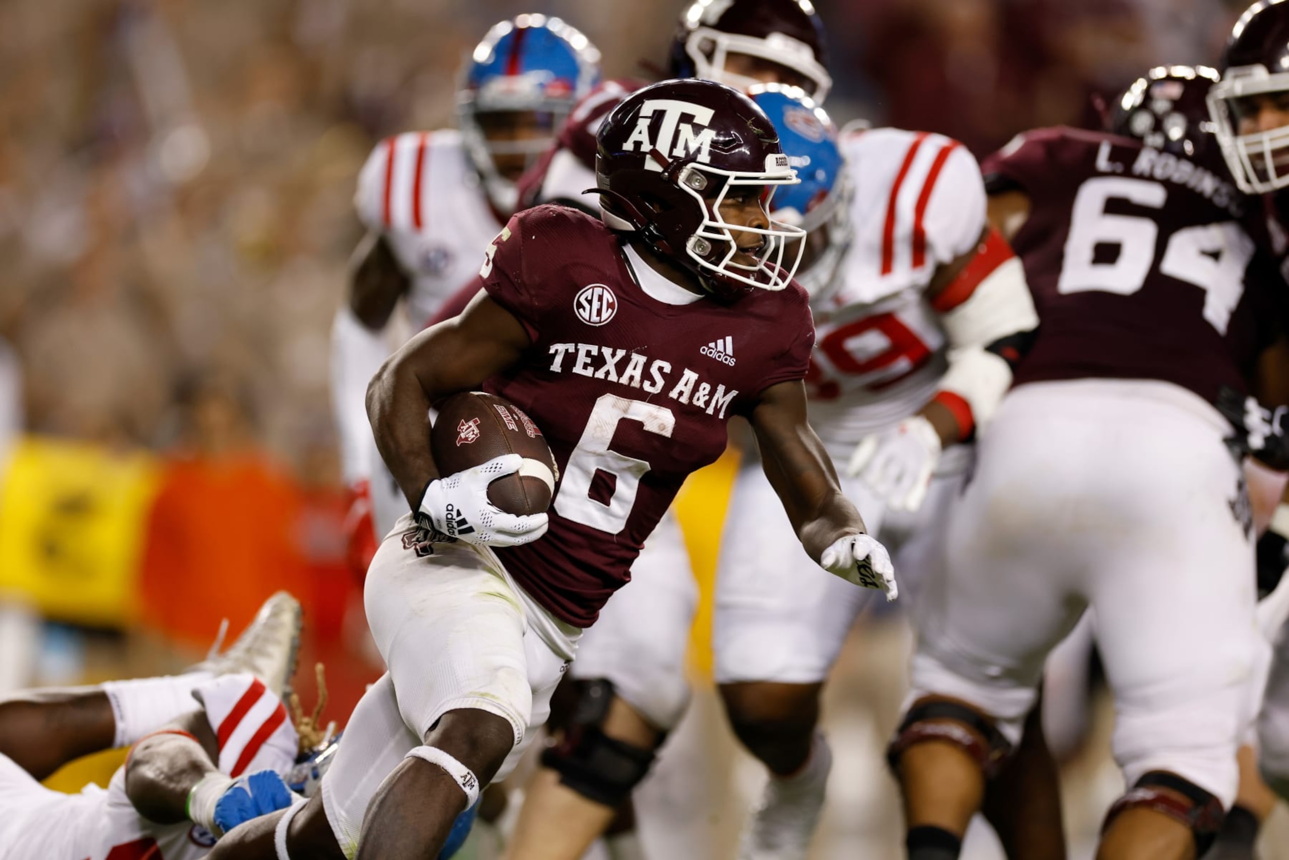 COLLEGE STATION, TEXAS - OCTOBER 29: Devon Achane #6 of the Texas A&M Aggies runs the ball in the first half against the Mississippi Rebels at Kyle Field on October 29, 2022 in College Station, Texas. (Photo by Tim Warner/Getty Images)