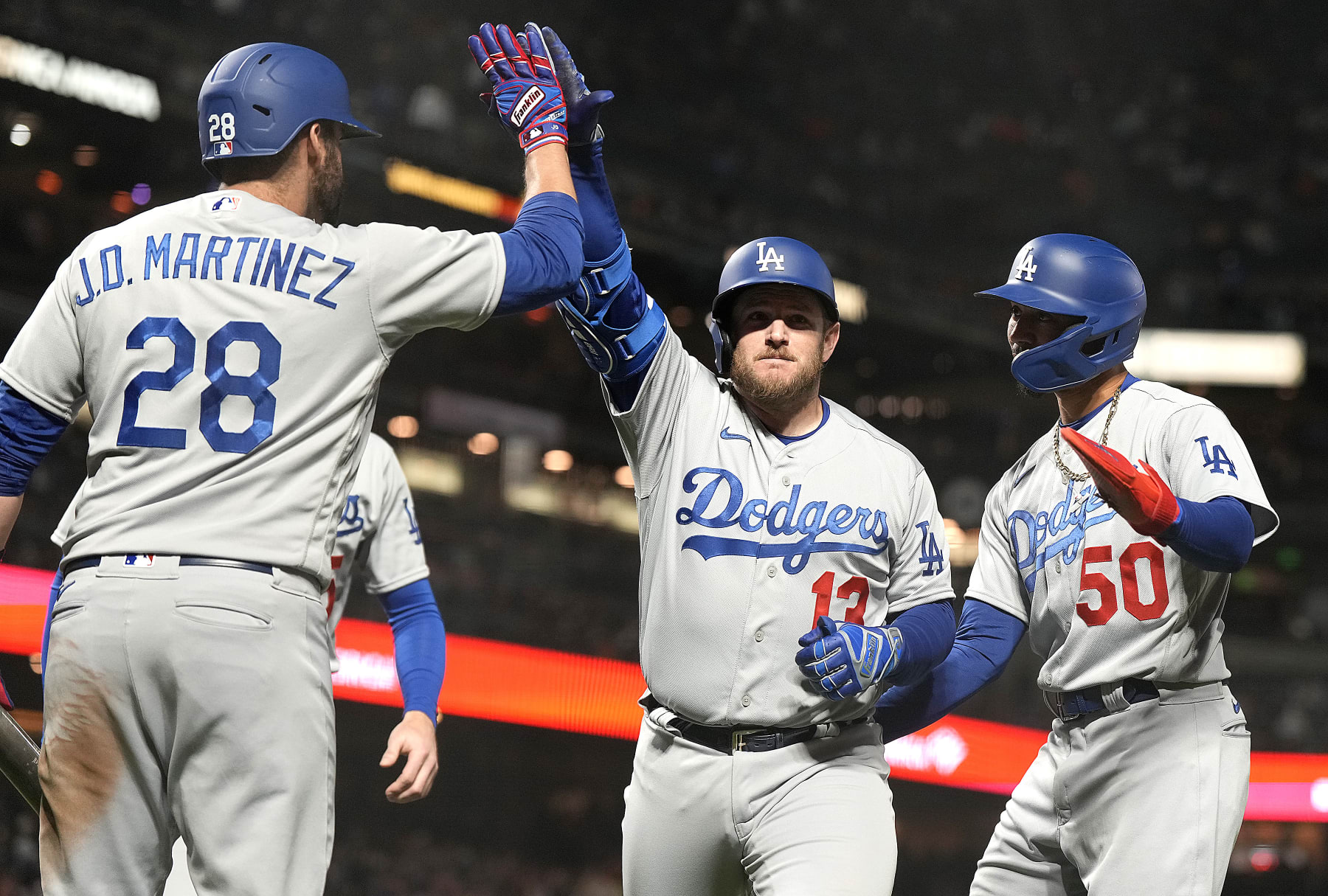 J.D. Martinez (L), Max Muncy (C) and Mookie Betts (R)