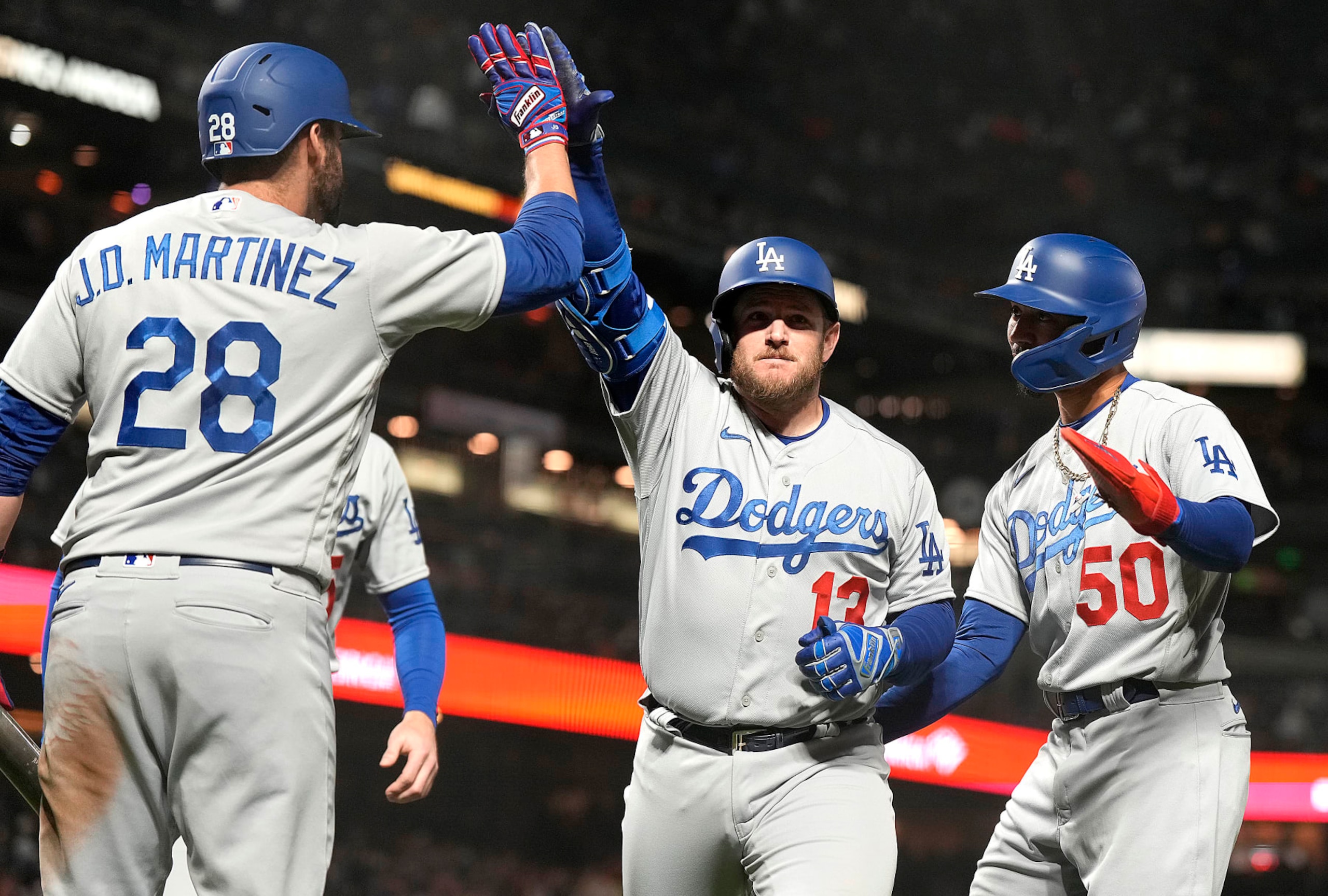 J.D. Martinez (L), Max Muncy (C) and Mookie Betts (R)
