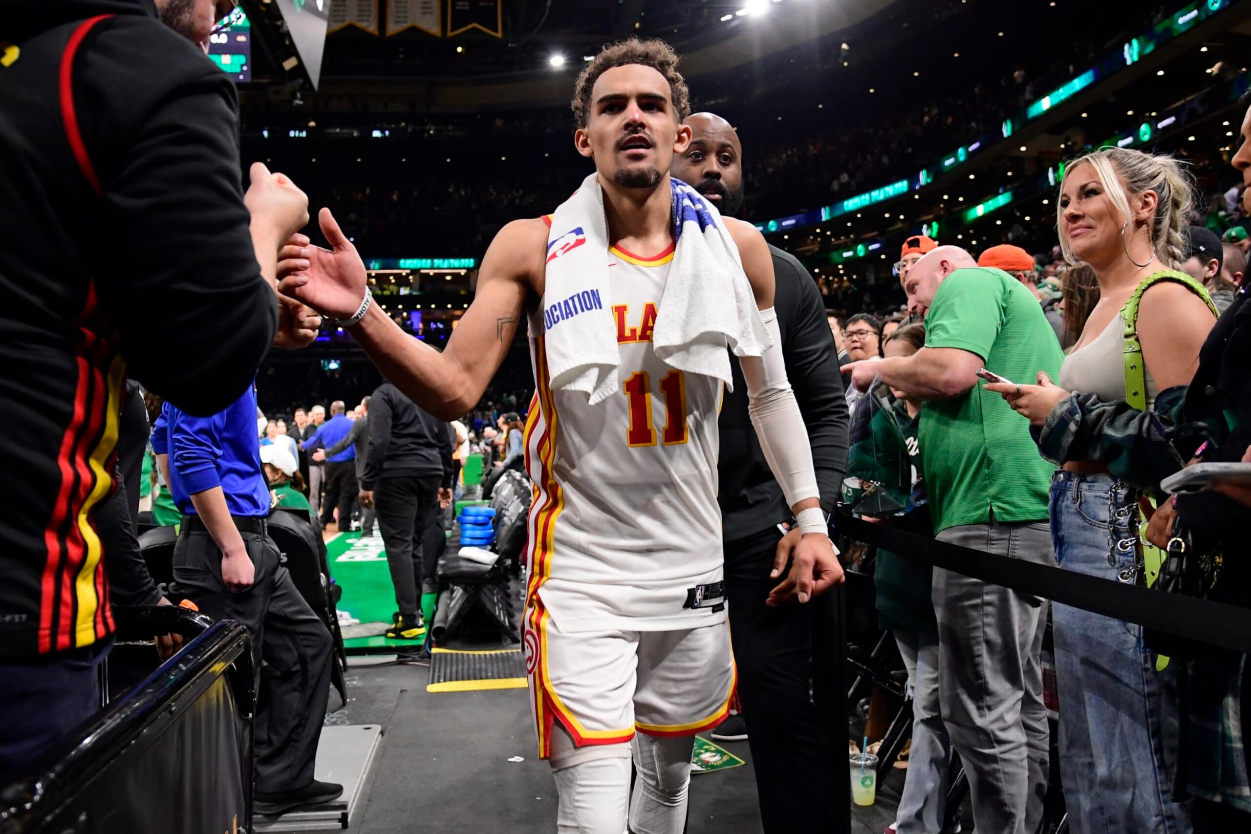 BOSTON, MA - APRIL 25: Trae Young #11 of the Atlanta Hawks high fives the fans after the game against the Boston Celtics during Round One Game Five of the 2023 NBA Playoffs on April 25, 2023 at the TD Garden in Boston, Massachusetts. NOTE TO USER: User expressly acknowledges and agrees that, by downloading and or using this photograph, User is consenting to the terms and conditions of the Getty Images License Agreement. Mandatory Copyright Notice: Copyright 2023 NBAE (Photo by Brian Babineau/NBAE via Getty Images) BOSTON, MA - APRIL 25: Trae Young #11 of the Atlanta Hawks high fives the fans after the game against the Boston Celtics during Round One Game Five of the 2023 NBA Playoffs on April 25, 2023 at the TD Garden in Boston, Massachusetts. NOTE TO USER: User expressly acknowledges and agrees that, by downloading and or using this photograph, User is consenting to the terms and conditions of the Getty Images License Agreement. Mandatory Copyright Notice: Copyright 2023 NBAE (Photo by Brian Babineau/NBAE via Getty Images)