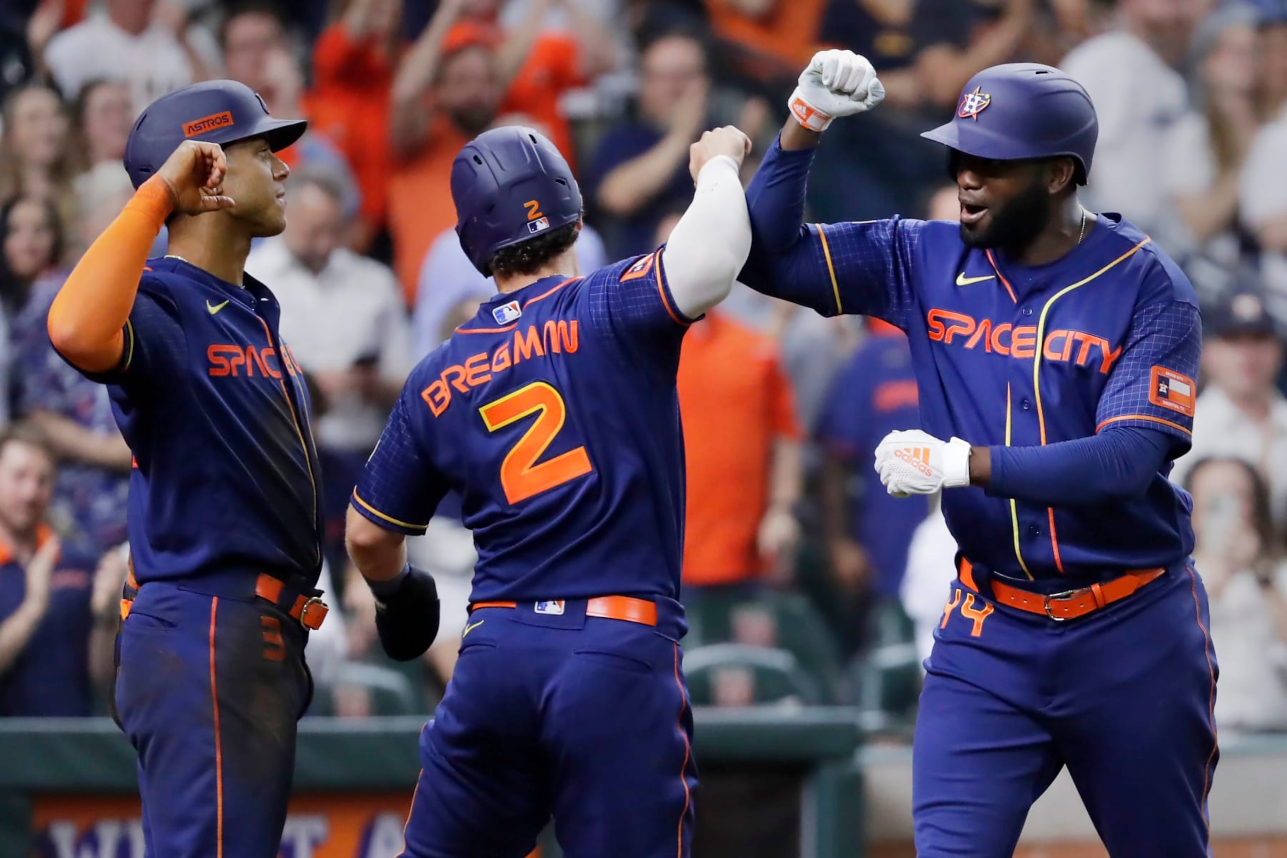 Jeremy Peña (L), Alex Bregman (C) and Yordan Álvarez (R)