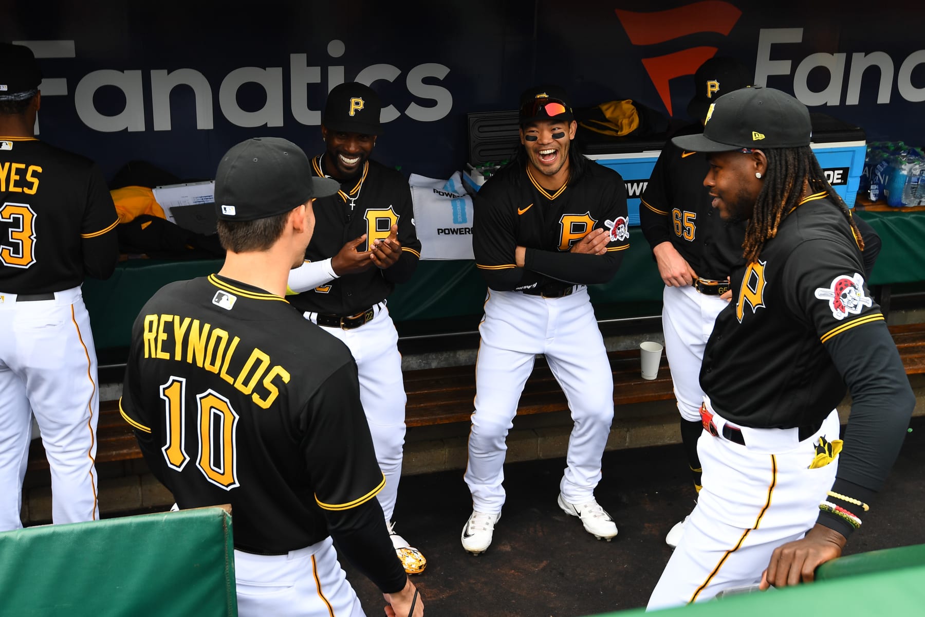 PITTSBURGH, PA - APRIL 07:  Bryan Reynolds  #10, Andrew McCutchen #22, Connor Joe #2 and Oneil Cruz #15 of the Pittsburgh Pirates laugh in the dugout before the game between the Chicago White Sox and the Pittsburgh Pirates at PNC Park on Friday, April 7, 2023 in Pittsburgh, Pennsylvania. (Photo by Joe Sargent/MLB Photos via Getty Images)