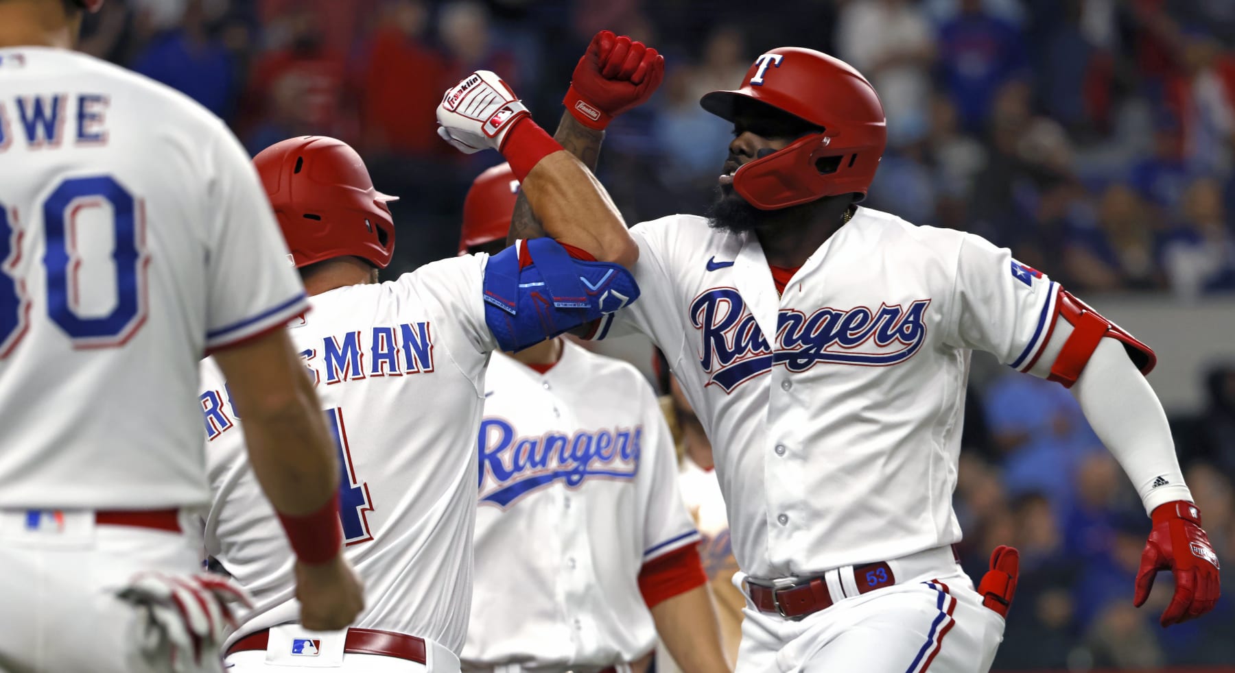 ARLINGTON, TX - APRIL 10: Adolis Garcia #53 of the Texas Rangers celebrates with teammates after hitting a grand slam against the Kansas City Royals during the sixth inning at Globe Life Field on April 10, 2023 in Arlington, Texas. (Photo by Ron Jenkins/Getty Images)