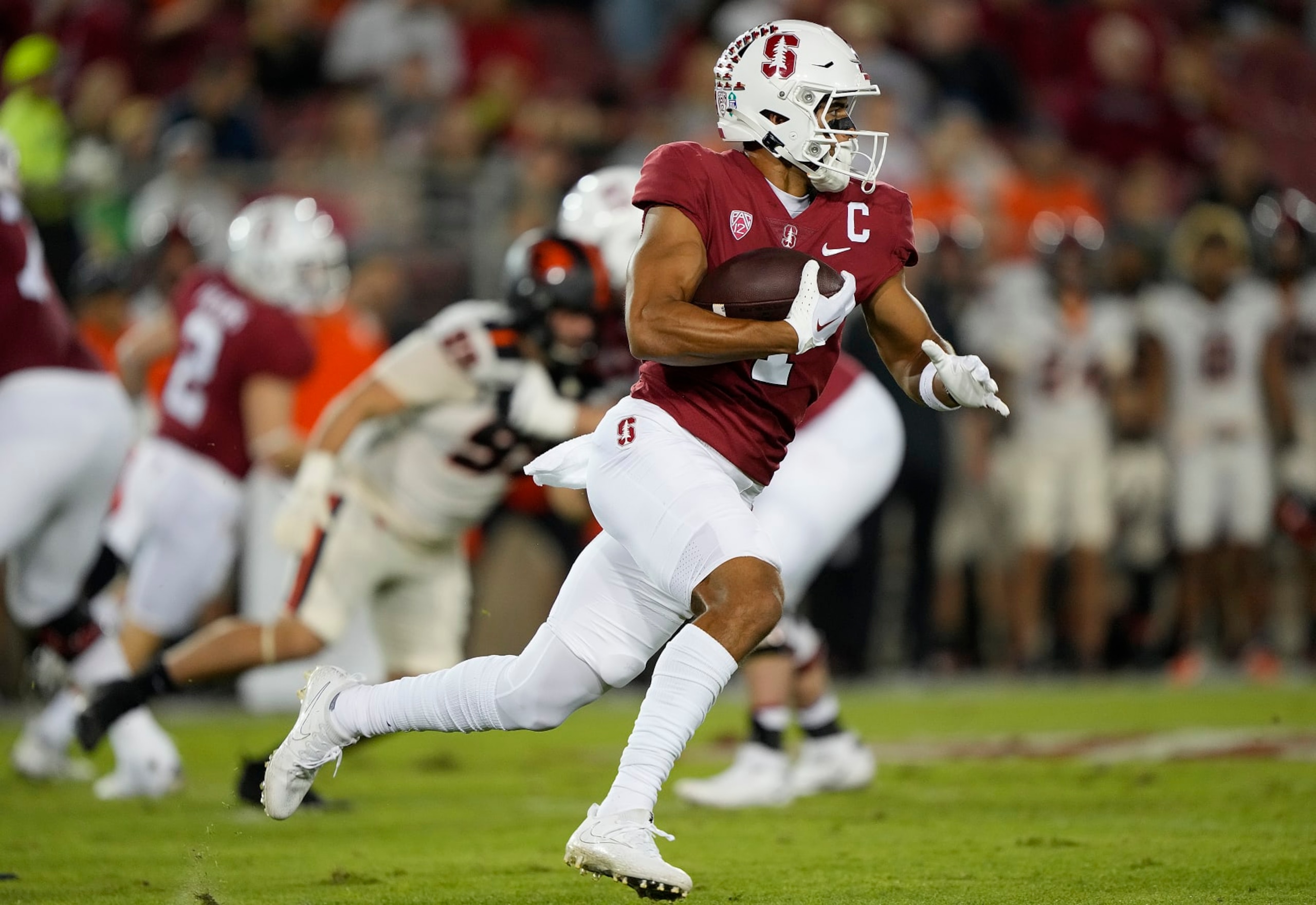 STANFORD, CALIFORNIA - OCTOBER 08: Michael Wilson #4 of the Stanford Cardinal carries the ball agains the Oregon State Beavers during the first quarter at Stanford Stadium on October 08, 2022 in Stanford, California. (Photo by Thearon W. Henderson/Getty Images)