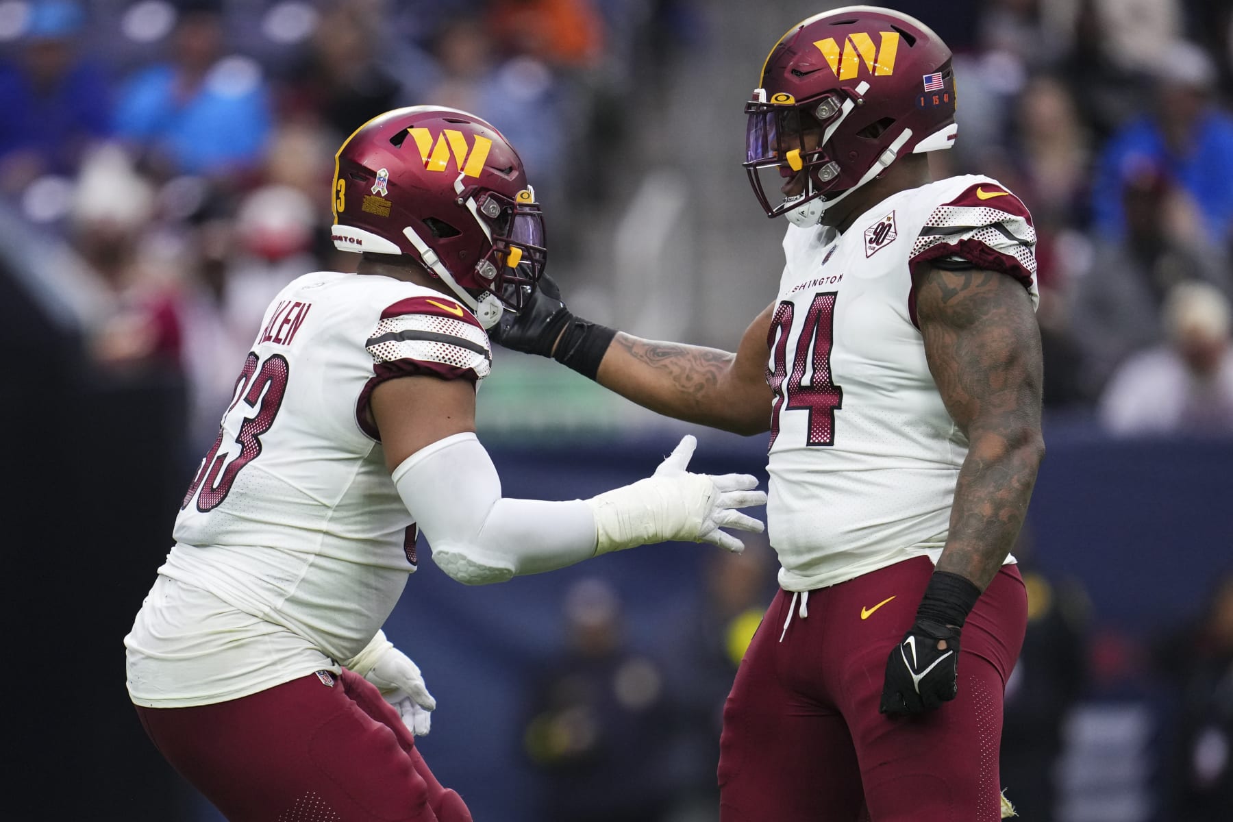 HOUSTON, TX - NOVEMBER 20: Jonathan Allen #93 of the Washington Commanders celebrates with Daron Payne #94 against the Houston Texans at NRG Stadium on November 20, 2022 in Houston, Texas. (Photo by Cooper Neill/Getty Images)