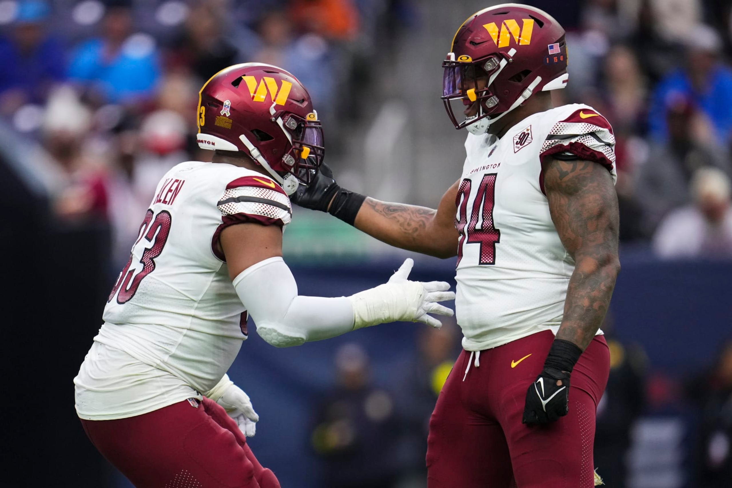 HOUSTON, TX - NOVEMBER 20: Jonathan Allen #93 of the Washington Commanders celebrates with Daron Payne #94 against the Houston Texans at NRG Stadium on November 20, 2022 in Houston, Texas. (Photo by Cooper Neill/Getty Images)