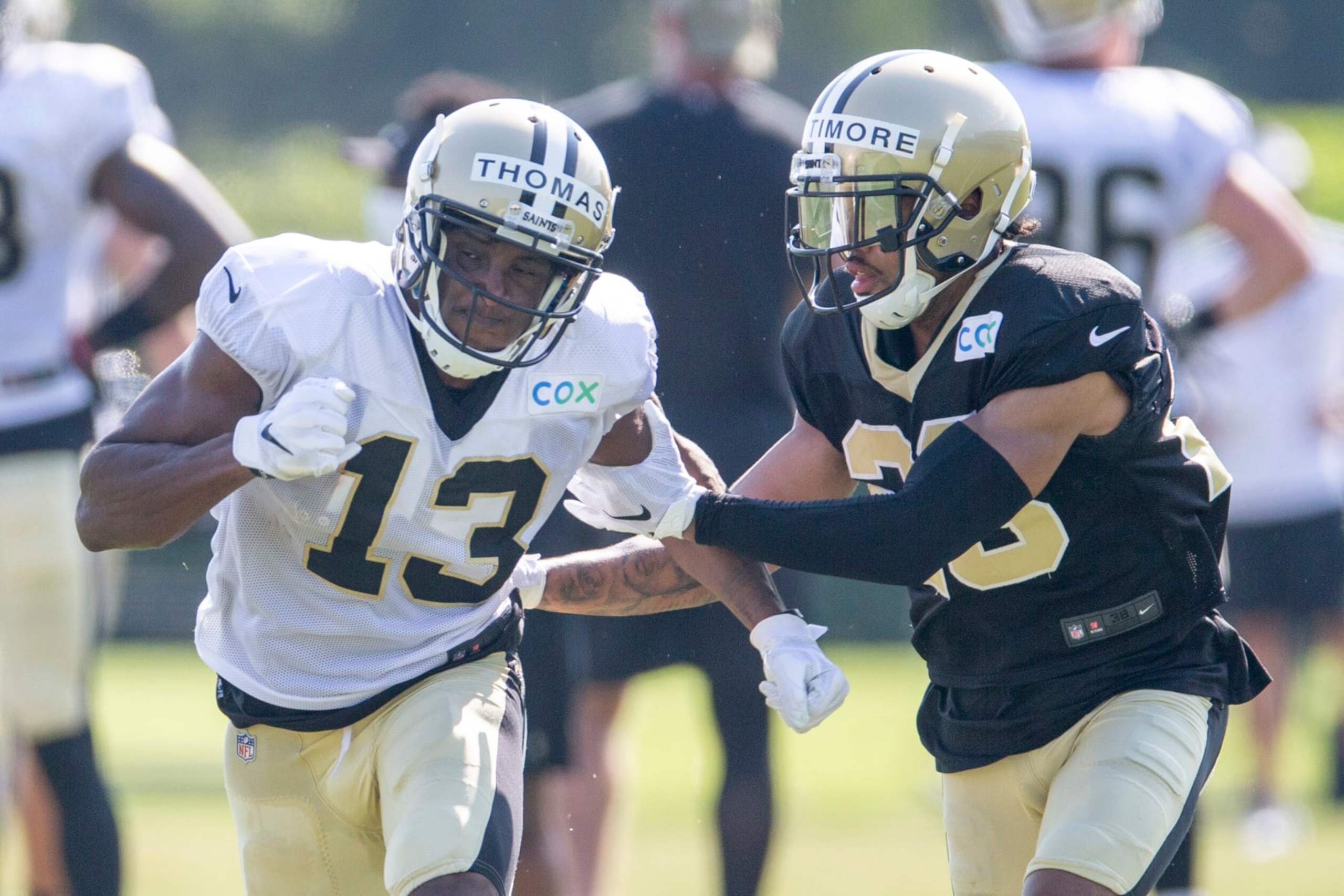 New Orleans Saints wide receiver Michael Thomas (13) is guarded by New Orleans Saints cornerback Marshon Lattimore (23) during NFL football training camp in Metairie, La., Friday, Aug. 21, 2020. (David Grunfeld/The Advocate via AP, Pool)