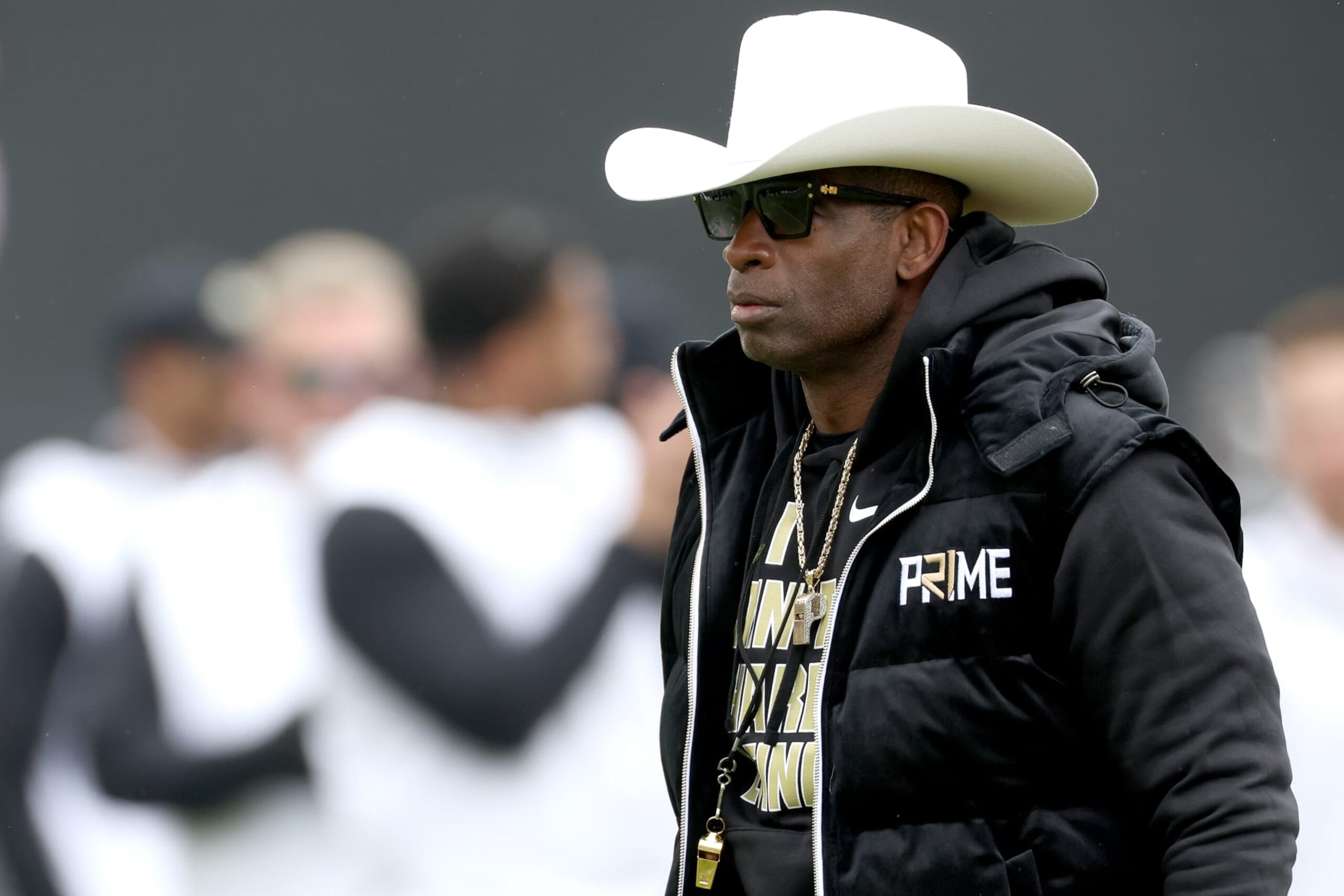 BOULDER, COLORADO - APRIL 22: Head coach Deion Sanders of the Colorado Buffaloes watches as his team warms up prior to their spring game at Folsom Field on April 22, 2023 in Boulder, Colorado. (Photo by Matthew Stockman/Getty Images)