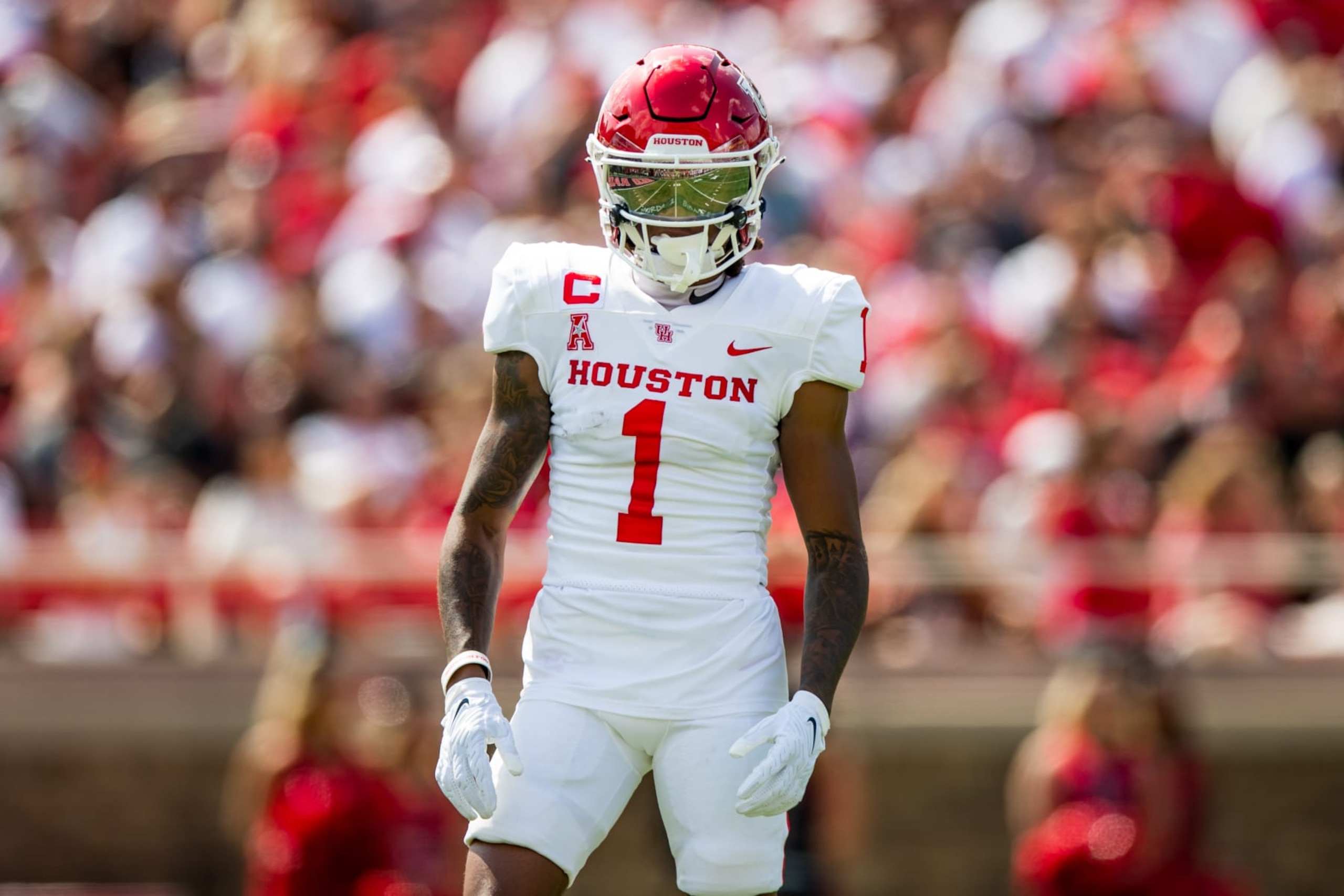 LUBBOCK, TEXAS - SEPTEMBER 10: Wide receiver Nathaniel Dell #1 of the Houston Cougars stands on the field during the first half of the game against the Texas Tech Red Raiders at Jones AT&T Stadium on September 10, 2022 in Lubbock, Texas. (Photo by John E. Moore III/Getty Images) LUBBOCK, TEXAS - SEPTEMBER 10: Wide receiver Nathaniel Dell #1 of the Houston Cougars stands on the field during the first half of the game against the Texas Tech Red Raiders at Jones AT&T Stadium on September 10, 2022 in Lubbock, Texas. (Photo by John E. Moore III/Getty Images)