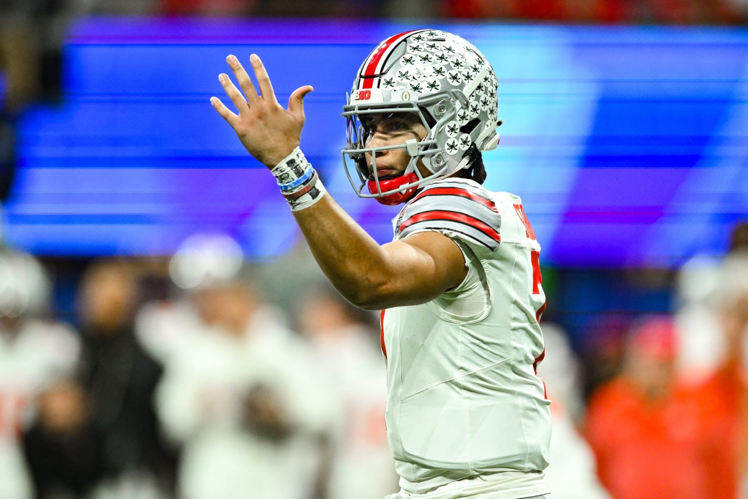 ATLANTA, GA  DECEMBER 31:  Ohio State quarterback C.J. Stroud (7) gestures during the Chick-fil-A Peach Bowl college football playoff game between the Ohio State Buckeyes and the Georgia Bulldogs on December 31st, 2022 at Mercedes-Benz Stadium in Atlanta, GA.  (Photo by Rich von Biberstein/Icon Sportswire via Getty Images)