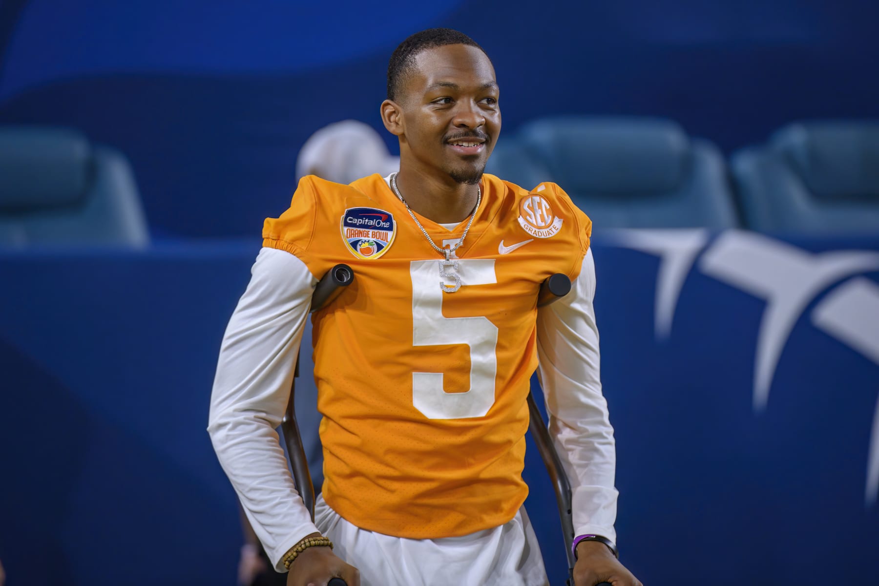 MIAMI GARDENS, FL - DECEMBER 30: Injured Tennessee quarterback Hendon Hooker (5) smiles as he stands on the field with crutches before the Capital One Orange Bowl college football game between the Tennessee Volunteers and the Clemson Tigers on December 30, 2022 at the Hard Rock Stadium in Miami Gardens, FL. (Photo by Doug Murray/Icon Sportswire via Getty Images)