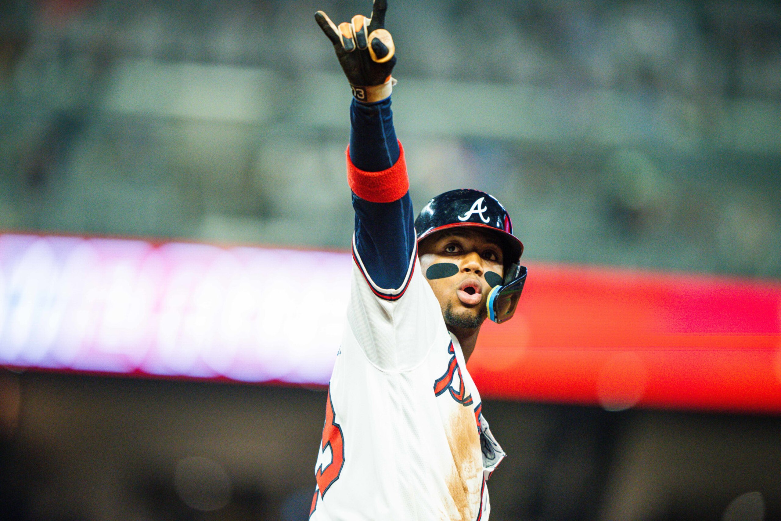 ATLANTA, GA - APRIL 26: Ronald Acuña Jr. #13 of the Atlanta Braves gestures as he rounds the bases after hitting a home run during the sixth inning against the Miami Marlins at Truist Park on April 26, 2023 in Atlanta, Georgia. (Photo by Kevin D. Liles/Atlanta Braves/Getty Images)