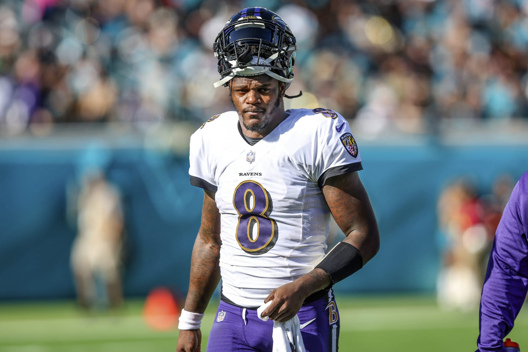 FILE - Baltimore Ravens quarterback Lamar Jackson (8) looks on during a timeout in the first half of an NFL football game against the Jacksonville Jaguars, Sunday, Nov. 27, 2022, in Jacksonville, Fla. The Ravens agreed in principle with Jackson on a five-year deal Thursday, April 27, 2023, securing their star quarterback for the foreseeable future and ending a contract negotiation saga that was dominating the team's offseason. (AP Photo/Gary McCullough, File)