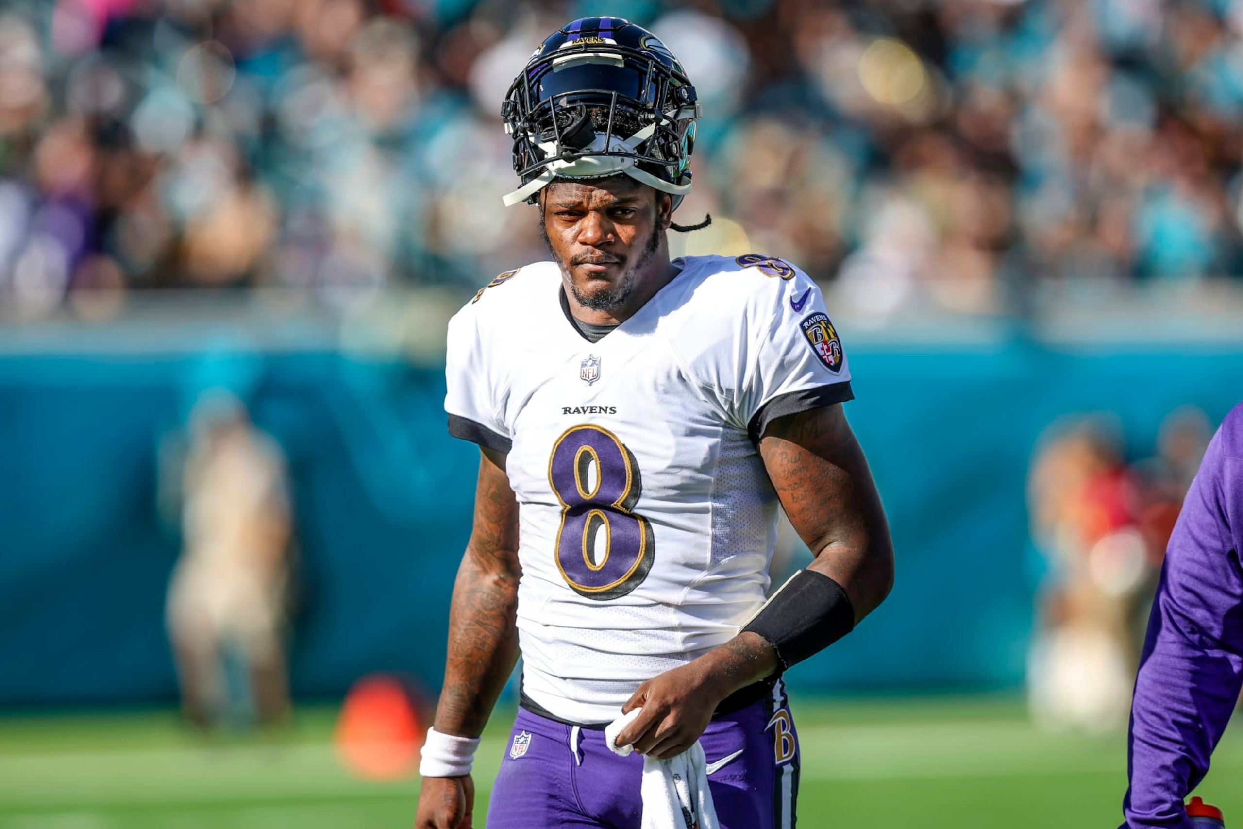 FILE - Baltimore Ravens quarterback Lamar Jackson (8) looks on during a timeout in the first half of an NFL football game against the Jacksonville Jaguars, Sunday, Nov. 27, 2022, in Jacksonville, Fla. The Ravens agreed in principle with Jackson on a five-year deal Thursday, April 27, 2023, securing their star quarterback for the foreseeable future and ending a contract negotiation saga that was dominating the team's offseason. (AP Photo/Gary McCullough, File) FILE - Baltimore Ravens quarterback Lamar Jackson (8) looks on during a timeout in the first half of an NFL football game against the Jacksonville Jaguars, Sunday, Nov. 27, 2022, in Jacksonville, Fla. The Ravens agreed in principle with Jackson on a five-year deal Thursday, April 27, 2023, securing their star quarterback for the foreseeable future and ending a contract negotiation saga that was dominating the team's offseason. (AP Photo/Gary McCullough, File)