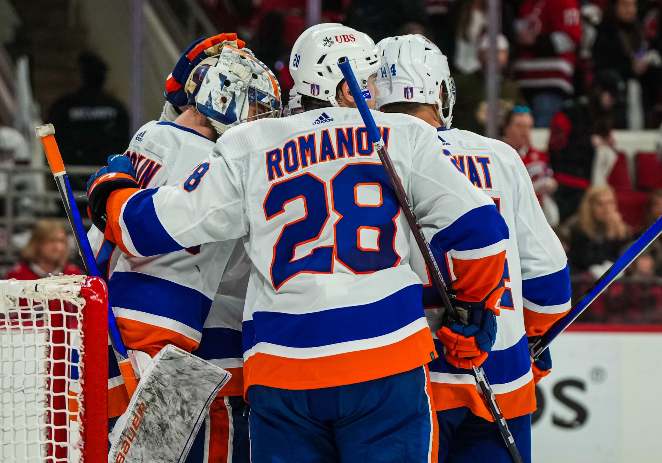 RALEIGH, NORTH CAROLINA - APRIL 25: Ilya Sorokin #30 of the New York Islanders celebrates with Alexander Romanov #28 and Bo Horvat #14 after the victory against the Carolina Hurricanes in Game Five of the First Round of the 2023 Stanley Cup Playoffs at PNC Arena on April 25, 2023 in Raleigh, North Carolina. (Photo by Josh Lavallee/NHLI via Getty Images)