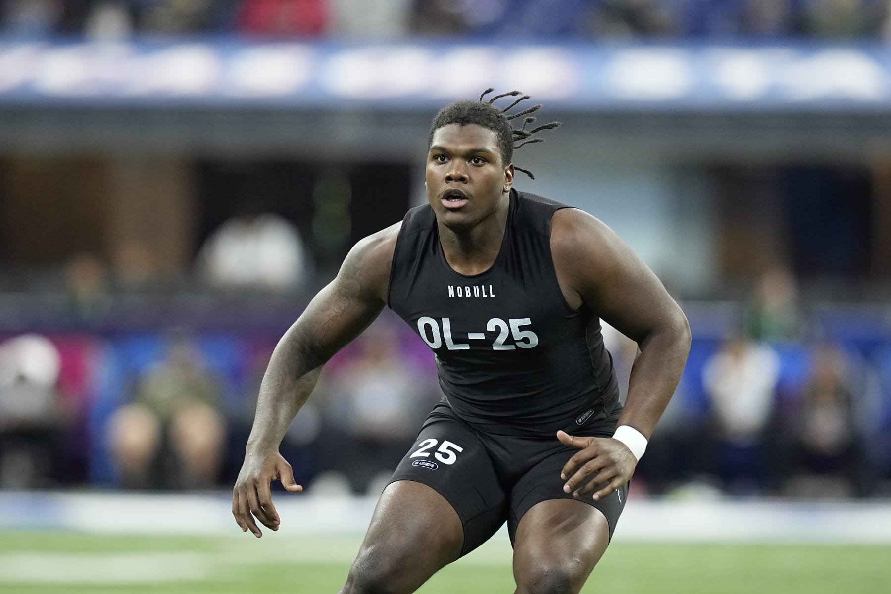 Georgia offensive lineman Broderick Jones runs a drill at the NFL football scouting combine in Indianapolis, Sunday, March 5, 2023. (AP Photo/Darron Cummings)