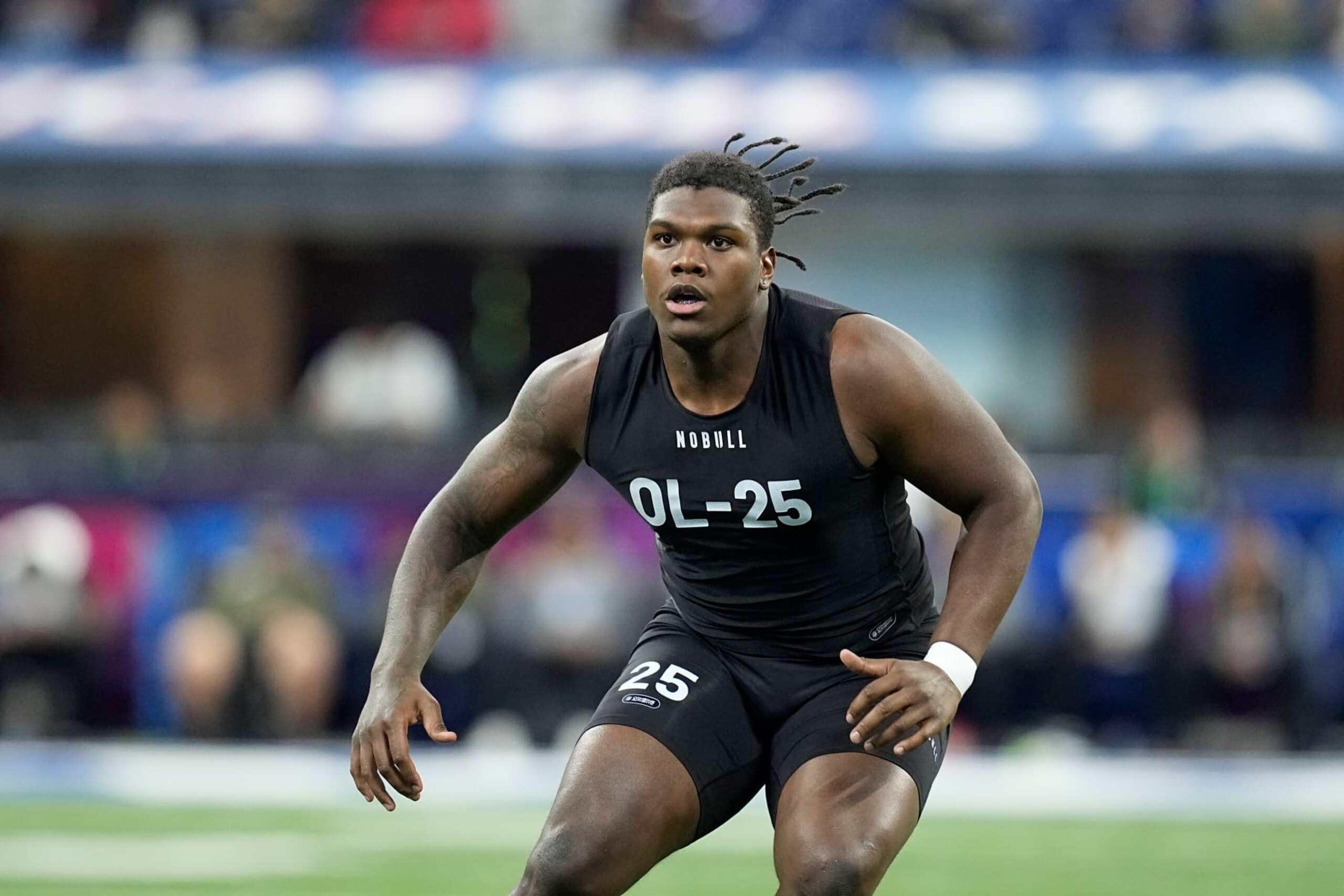 Georgia offensive lineman Broderick Jones runs a drill at the NFL football scouting combine in Indianapolis, Sunday, March 5, 2023. (AP Photo/Darron Cummings)