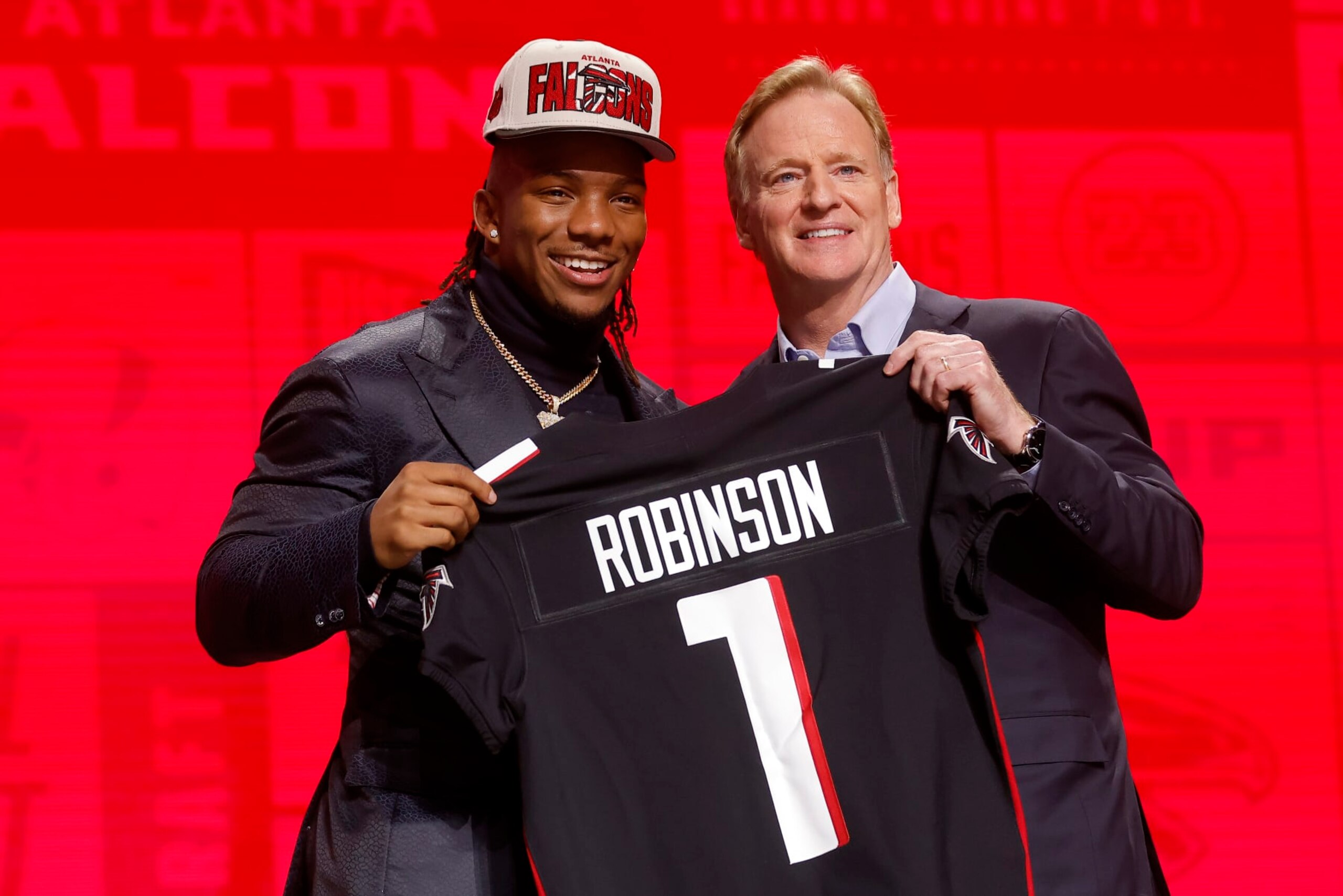KANSAS CITY, MISSOURI - APRIL 27: (L-R) Bijan Robinson poses with NFL Commissioner Roger Goodell after being selected eighth overall by the Atlanta Falcons during the first round of the 2023 NFL Draft at Union Station on April 27, 2023 in Kansas City, Missouri. (Photo by David Eulitt/Getty Images)