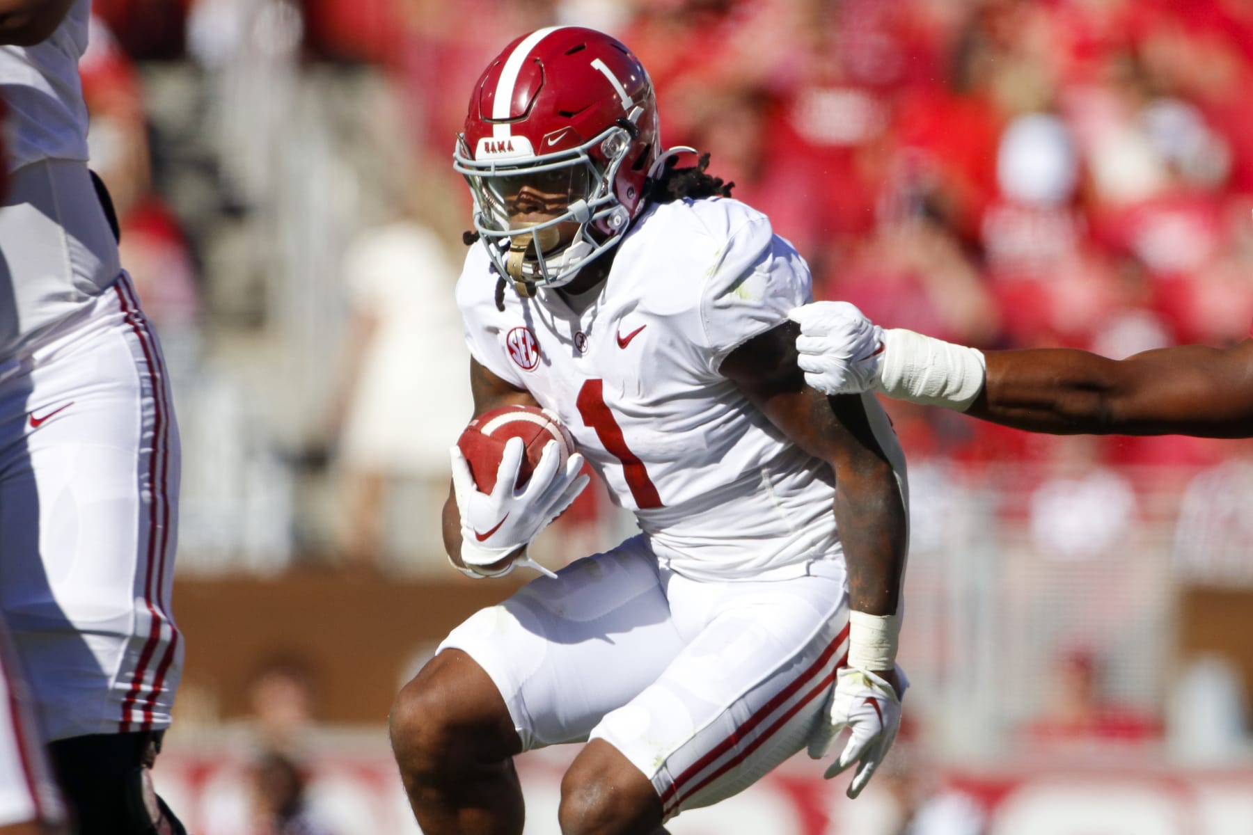 FAYETTEVILLE, AR - OCTOBER 01: Alabama Crimson Tide running back Jahmyr Gibbs (1) carries the football during the college football game between the Alabama Crimson Tide and Arkansas Razorbacks on October 1, 2022, at Donald W. Reynolds Razorback Stadium in Fayetteville, Arkansas. (Photo by Andy Altenburger/Icon Sportswire via Getty Images)