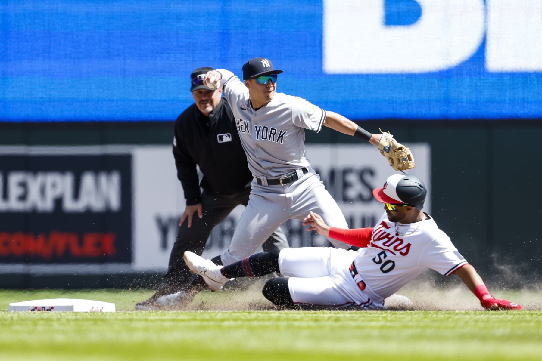 MINNEAPOLIS, MN - APRIL 26: Willi Castro #50 of the Minnesota Twins is out at second base as Anthony Volpe #11 of the New York Yankees throws the ball to first base on a fielder's choice in the seventh inning at Target Field on April 26, 2023 in Minneapolis, Minnesota. The Yankees defeated the Twins 12-6. (Photo by David Berding/Getty Images)