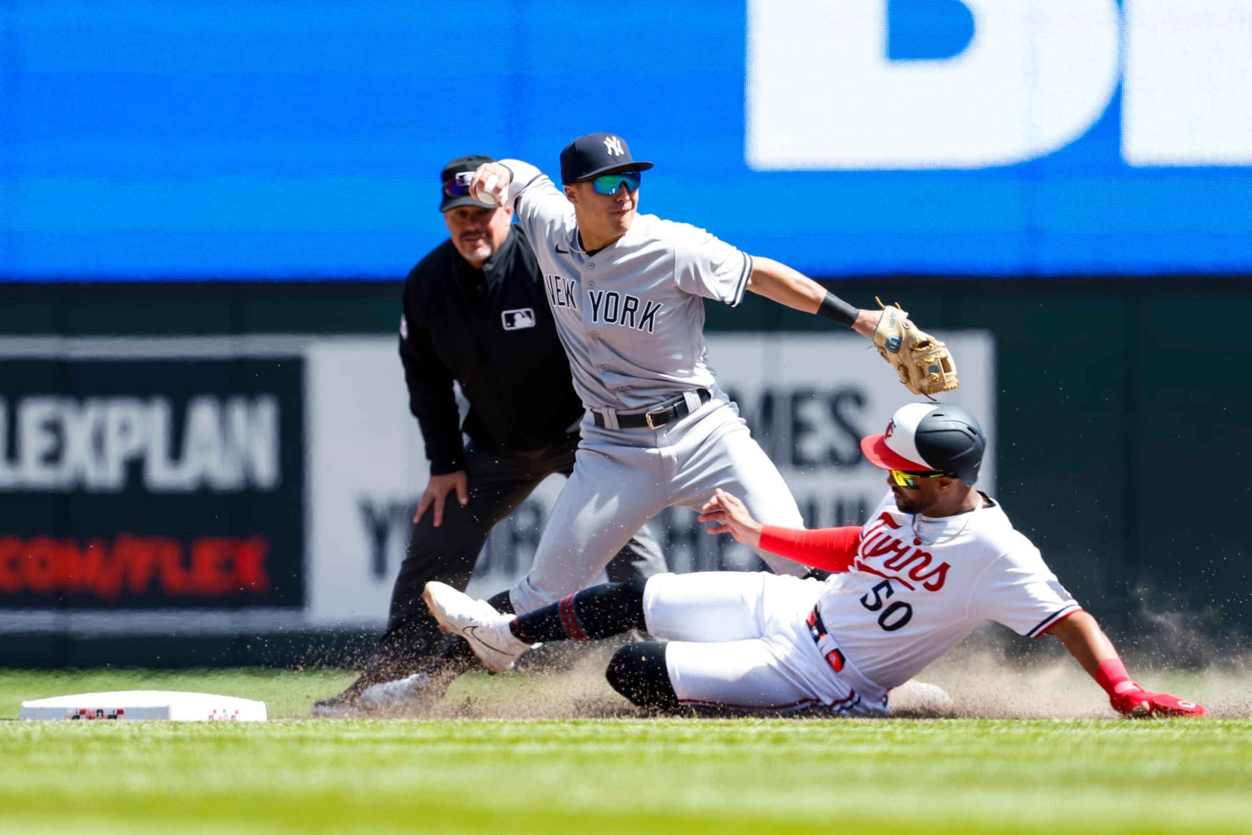 MINNEAPOLIS, MN - APRIL 26: Willi Castro #50 of the Minnesota Twins is out at second base as Anthony Volpe #11 of the New York Yankees throws the ball to first base on a fielder's choice in the seventh inning at Target Field on April 26, 2023 in Minneapolis, Minnesota. The Yankees defeated the Twins 12-6. (Photo by David Berding/Getty Images)