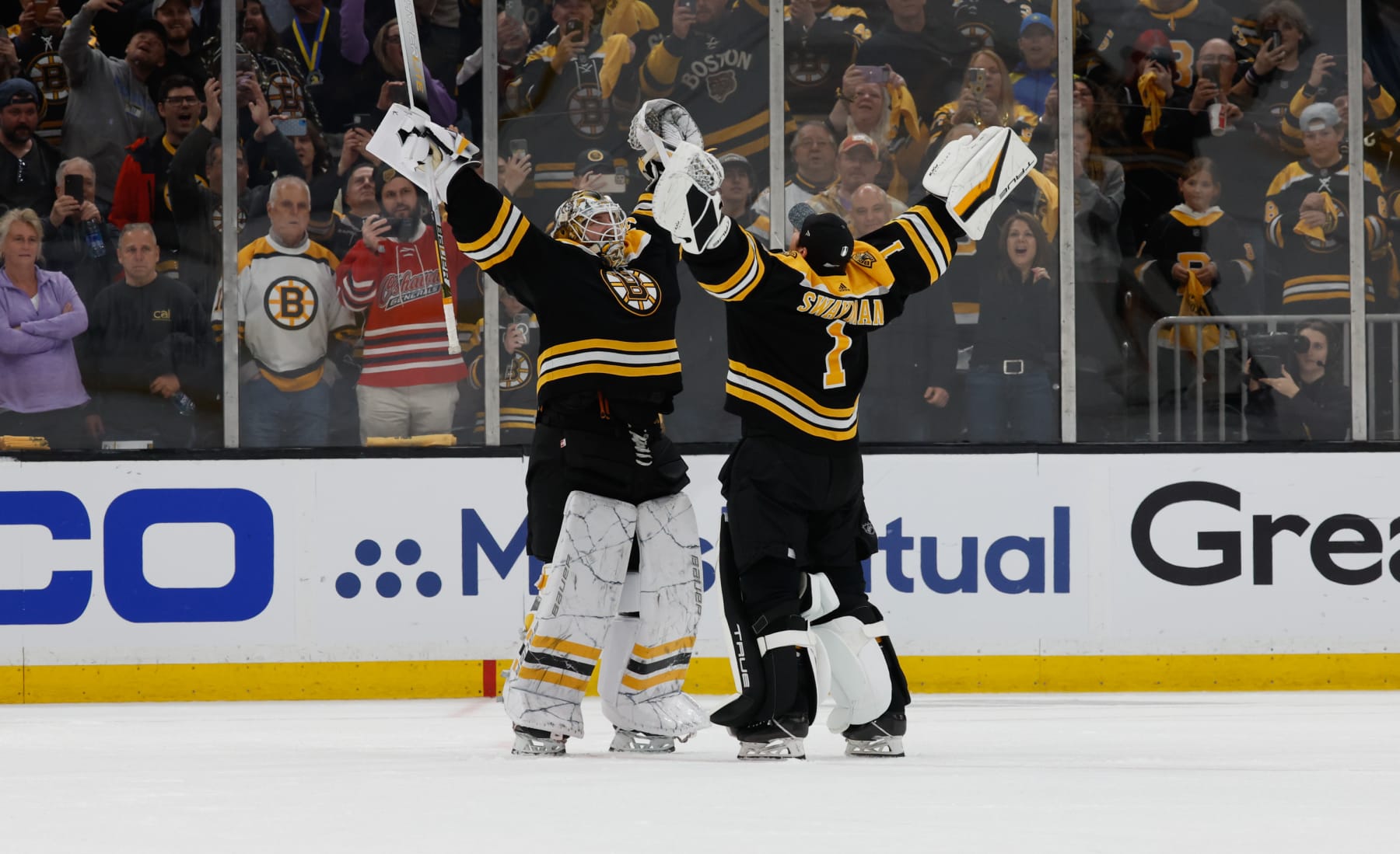 BOSTON, MA - APRIL 17: Linus Ullmark #35 of the Boston Bruins and teammate Jeremy Swayman #1 celebrate a win against the Florida Panthers after Game One of the First Round of the 2023 Stanley Cup Playoffs at the TD Garden on April 17, 2023 in Boston, Massachusetts. The Bruins won 3-1. (Photo by Rich Gagnon/Getty Images)