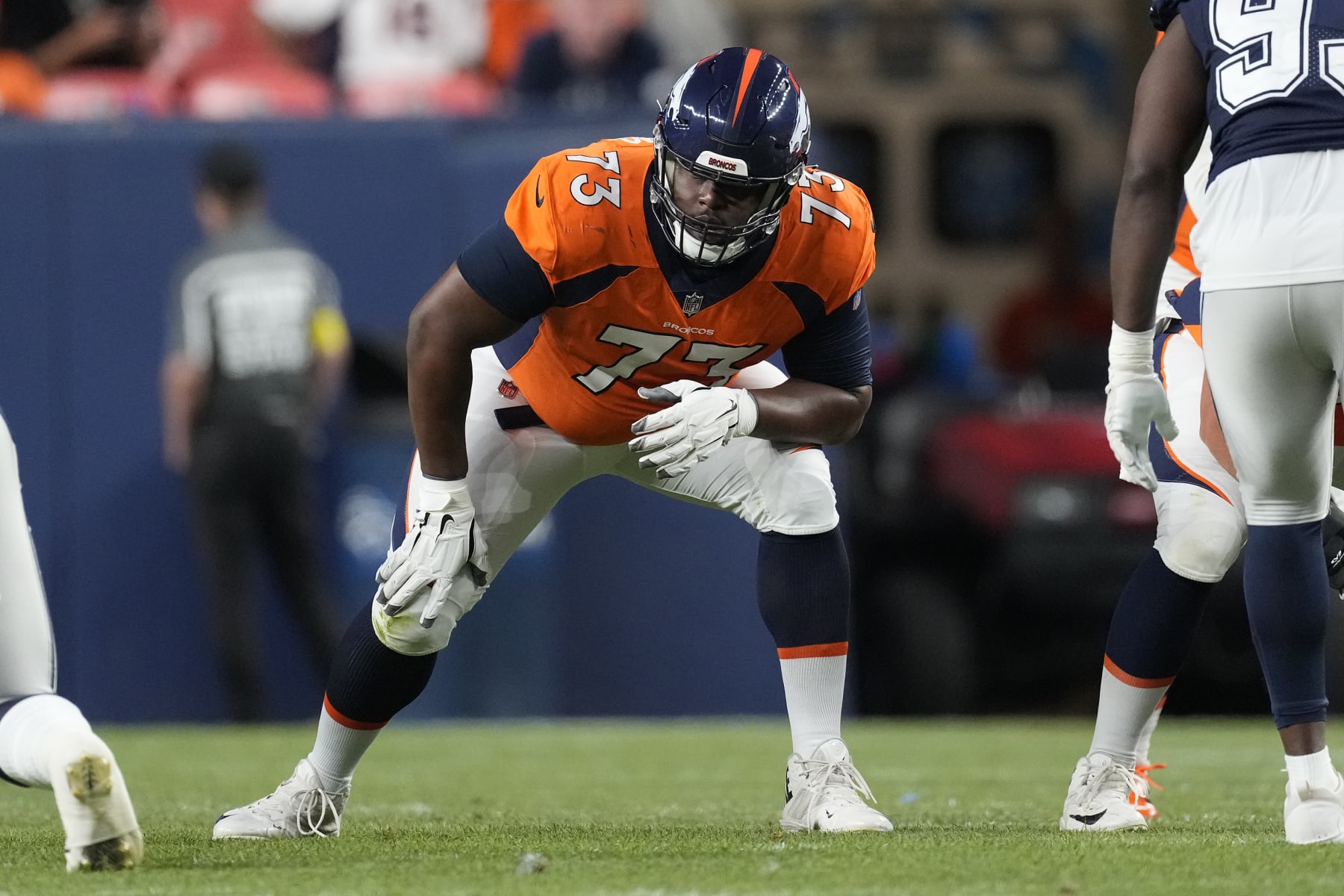 Denver Broncos offensive tackle Cameron Fleming (73) lines up against the Dallas Cowboys during the first half of an NFL preseason football game, Saturday, Aug. 13, 2022, in Denver. (AP Photo/David Zalubowski)