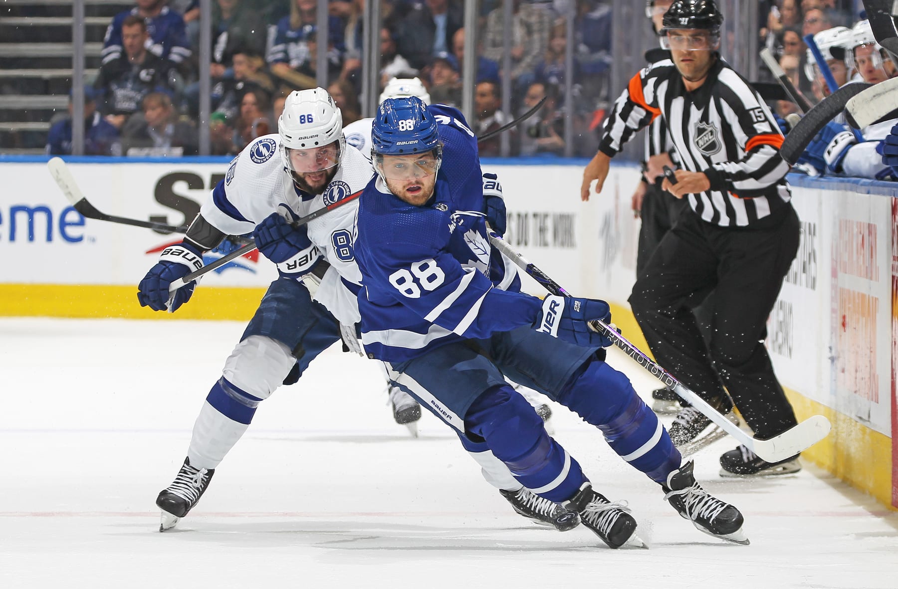 TORONTO, CANADA - APRIL 27:  Nikita Kucherov #86 of the Tampa Bay Lightning skates to check William Nylander #88 of the Toronto Maple Leafs during Game Five of the First Round of the 2023 Stanley Cup Playoffs at Scotiabank Arena on April 27, 2023 in Toronto, Ontario, Canada. (Photo by Claus Andersen/Getty Images)