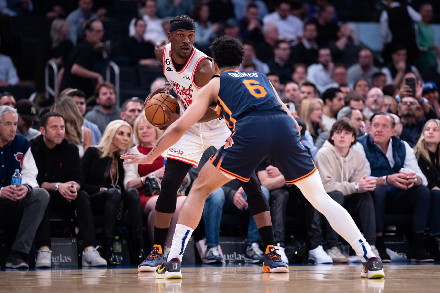 NEW YORK, NEW YORK - MARCH 29: Jimmy Butler #22 of the Miami Heat is guarded by Quentin Grimes #6 of the New York Knicks during the first quarter of the game at Madison Square Garden on March 29, 2023 in New York City. NOTE TO USER: User expressly acknowledges and agrees that, by downloading and or using this photograph, User is consenting to the terms and conditions of the Getty Images License Agreement. (Photo by Dustin Satloff/Getty Images)