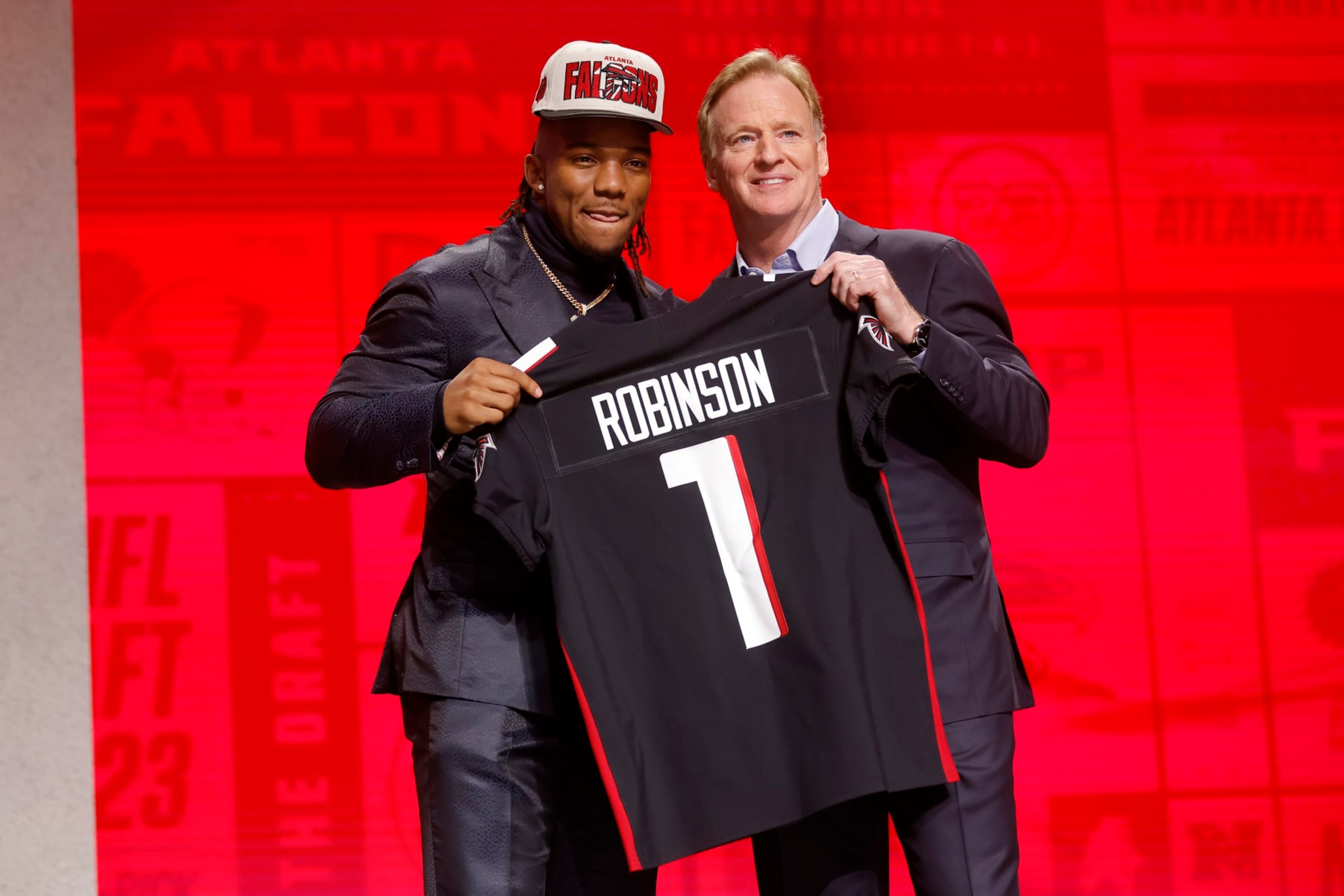 Bijan Robinson and NFL Commissioner Roger Goodell