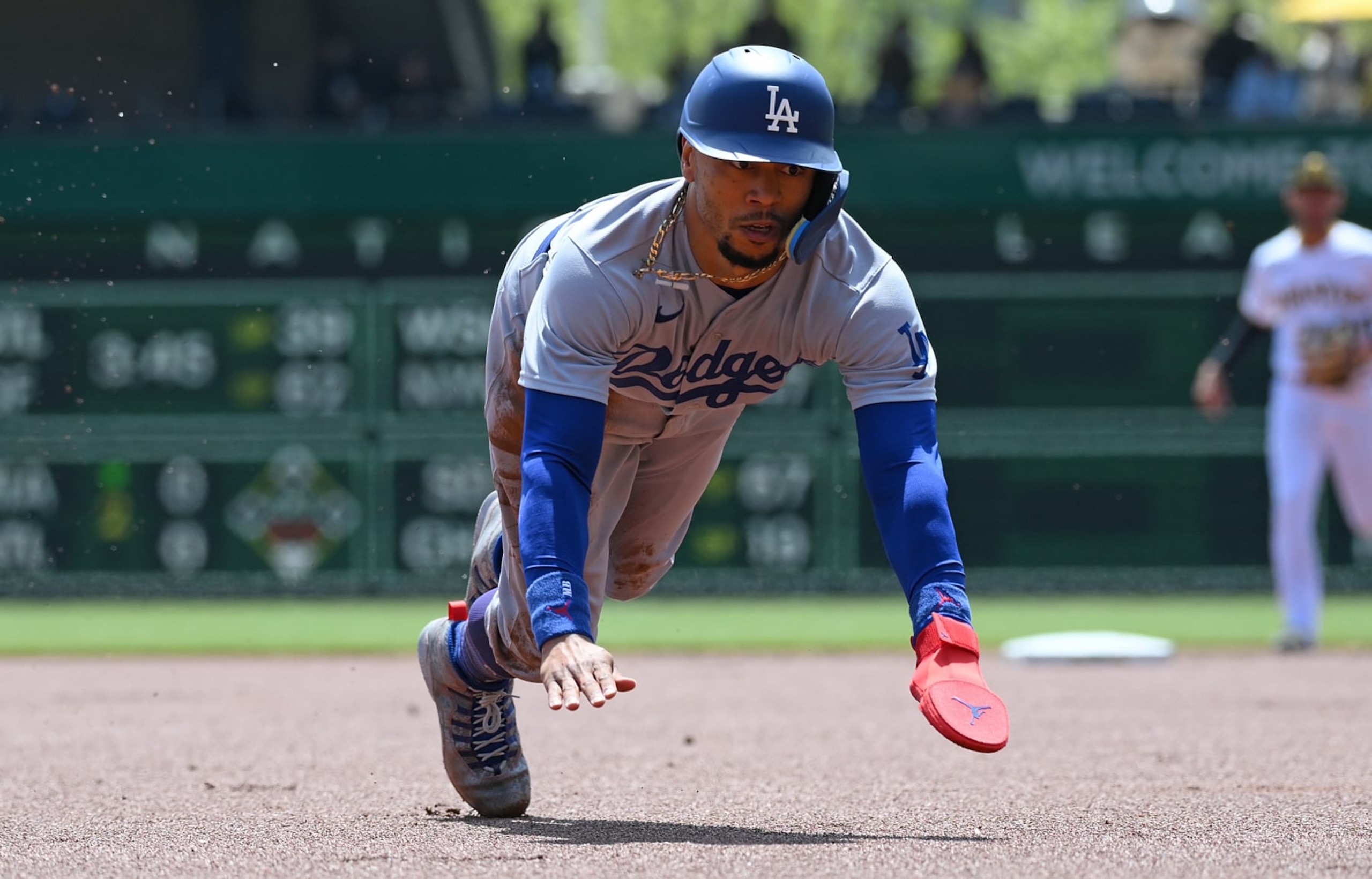 PITTSBURGH, PA - APRIL 27: Mookie Betts #50 of the Los Angeles Dodgers slides into third base after advancing on a single by Jason Heyward #23 (not pictured) in the first inning during the game against the Pittsburgh Pirates at PNC Park on April 27, 2023 in Pittsburgh, Pennsylvania. (Photo by Justin Berl/Getty Images)