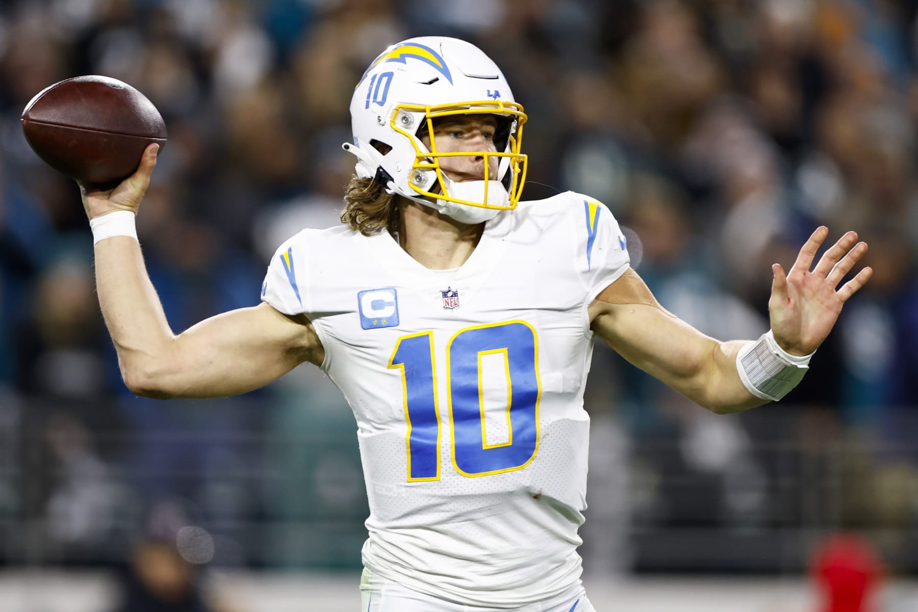 JACKSONVILLE, FLORIDA - JANUARY 14: Justin Herbert #10 of the Los Angeles Chargers throws a pass against the Jacksonville Jaguars during the second half of the game in the AFC Wild Card playoff game at TIAA Bank Field on January 14, 2023 in Jacksonville, Florida. (Photo by Douglas P. DeFelice/Getty Images) JACKSONVILLE, FLORIDA - JANUARY 14: Justin Herbert #10 of the Los Angeles Chargers throws a pass against the Jacksonville Jaguars during the second half of the game in the AFC Wild Card playoff game at TIAA Bank Field on January 14, 2023 in Jacksonville, Florida. (Photo by Douglas P. DeFelice/Getty Images)