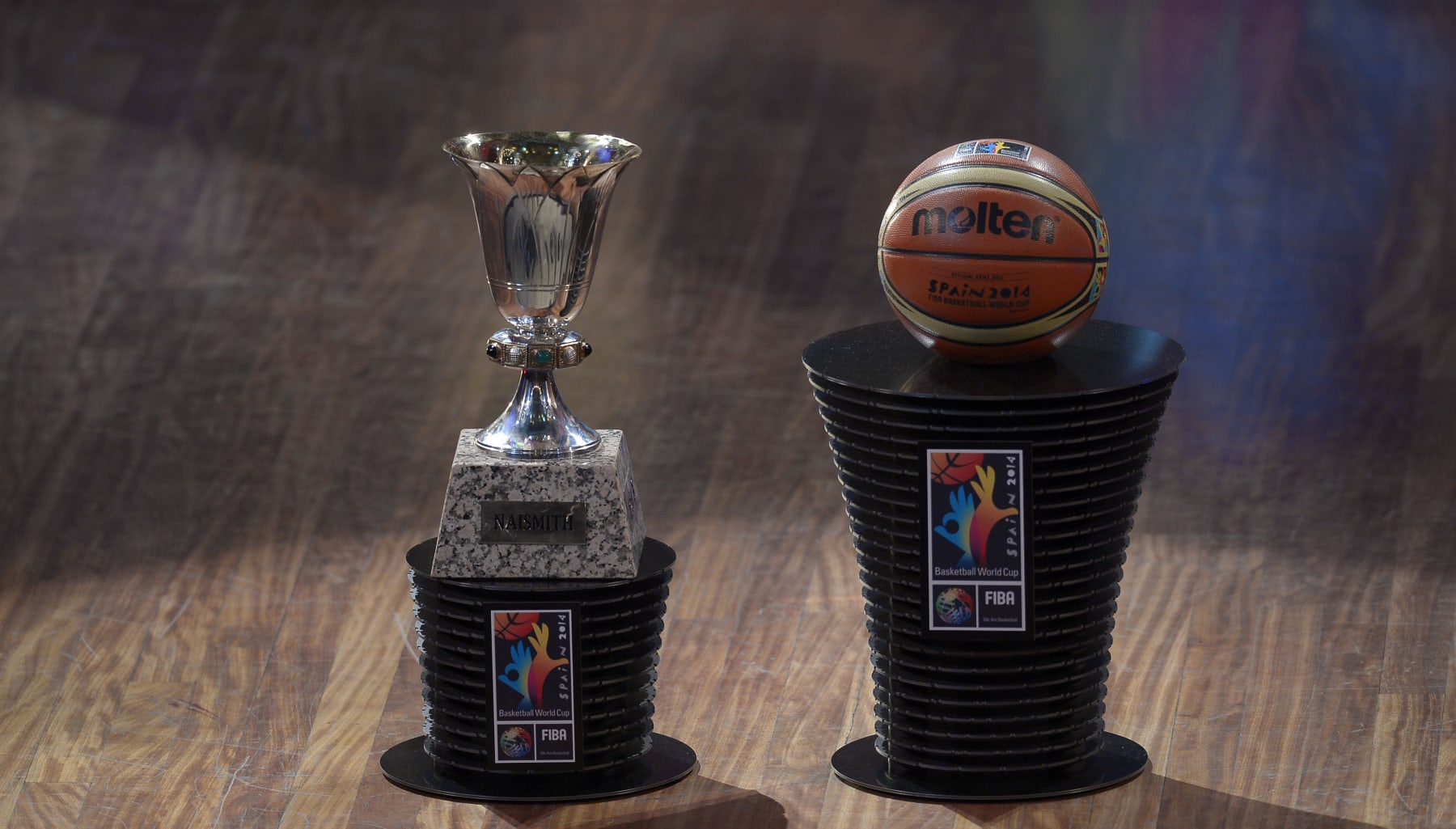 A basketball and a Naismith trophy are displayed during the FIBA Basketball World Cup official draw for the 2014 world cup, at the Palau de la Musica in Barcelona, Spain, Monday, Feb. 3, 2014. The competition will take place from 30 August to 14 September in Spain. (AP Photo/Manu Fernandez)