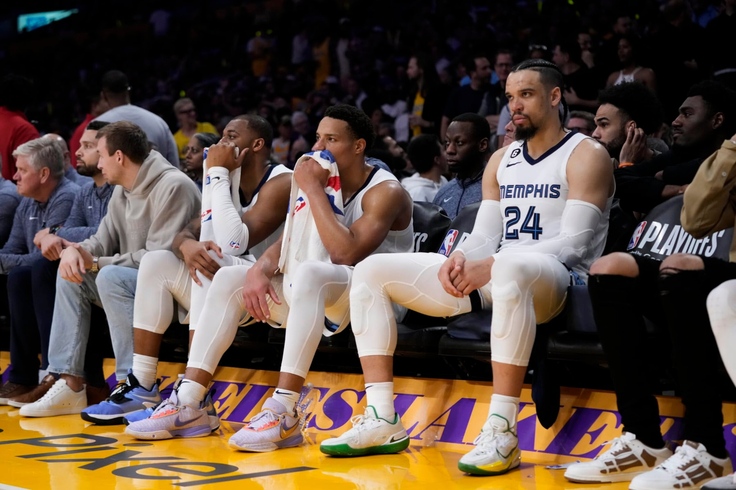 Memphis Grizzlies' Dillon Brooks, Desmond Bane and Xavier Tillman, from right, watch from the bench during the second half in Game 6 of the team's first-round NBA basketball playoff series against the Los Angeles Lakers Friday, April 28, 2023, in Los Angeles. The Lakers won 125-85. (AP Photo/Jae C. Hong)