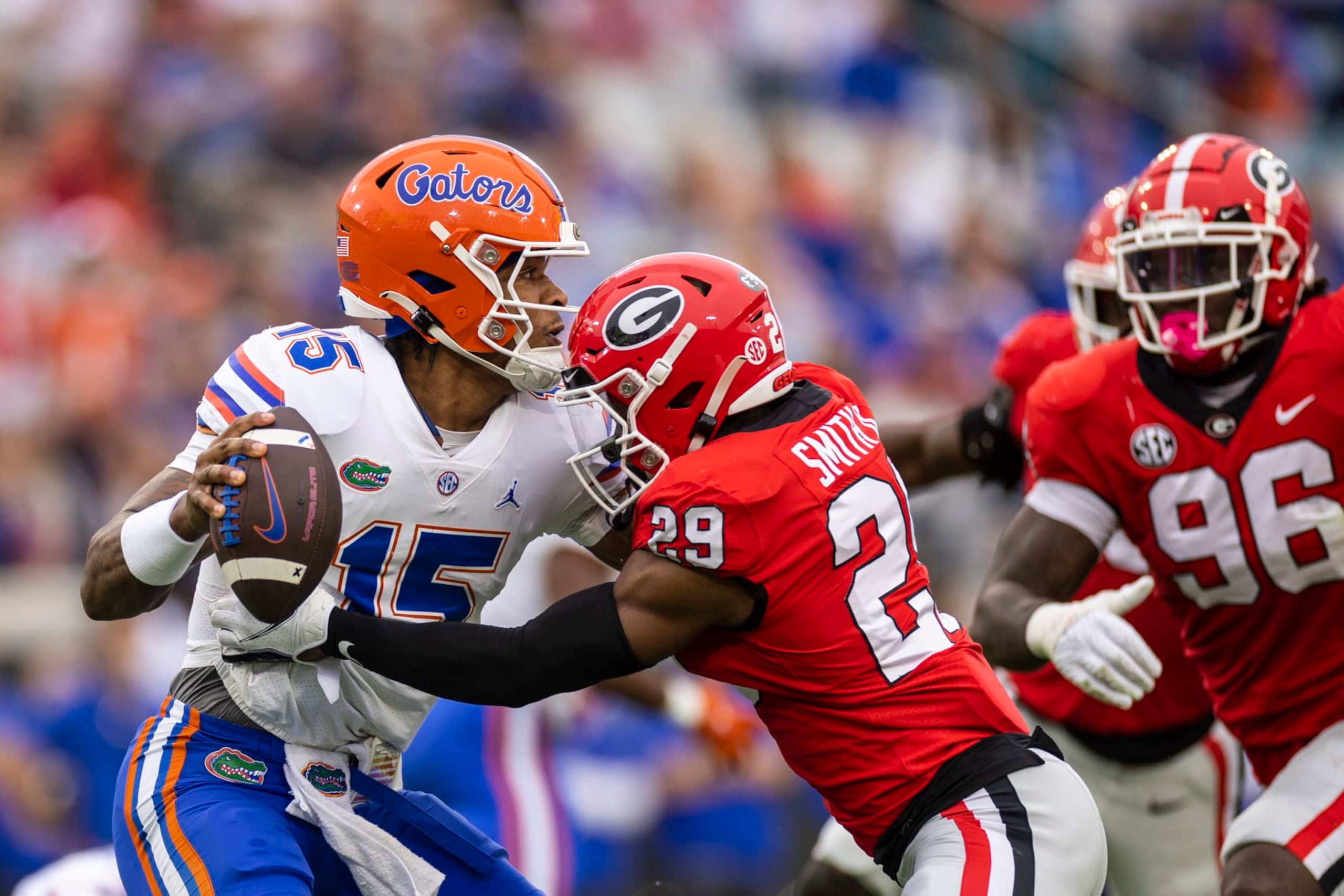 JACKSONVILLE, FLORIDA - OCTOBER 29:  Anthony Richardson #15 of the Florida Gators is pressured by Christopher Smith #29 of the Georgia Bulldogs during the first half of a game at TIAA Bank Field on October 29, 2022 in Jacksonville, Florida. (Photo by James Gilbert/Getty Images)